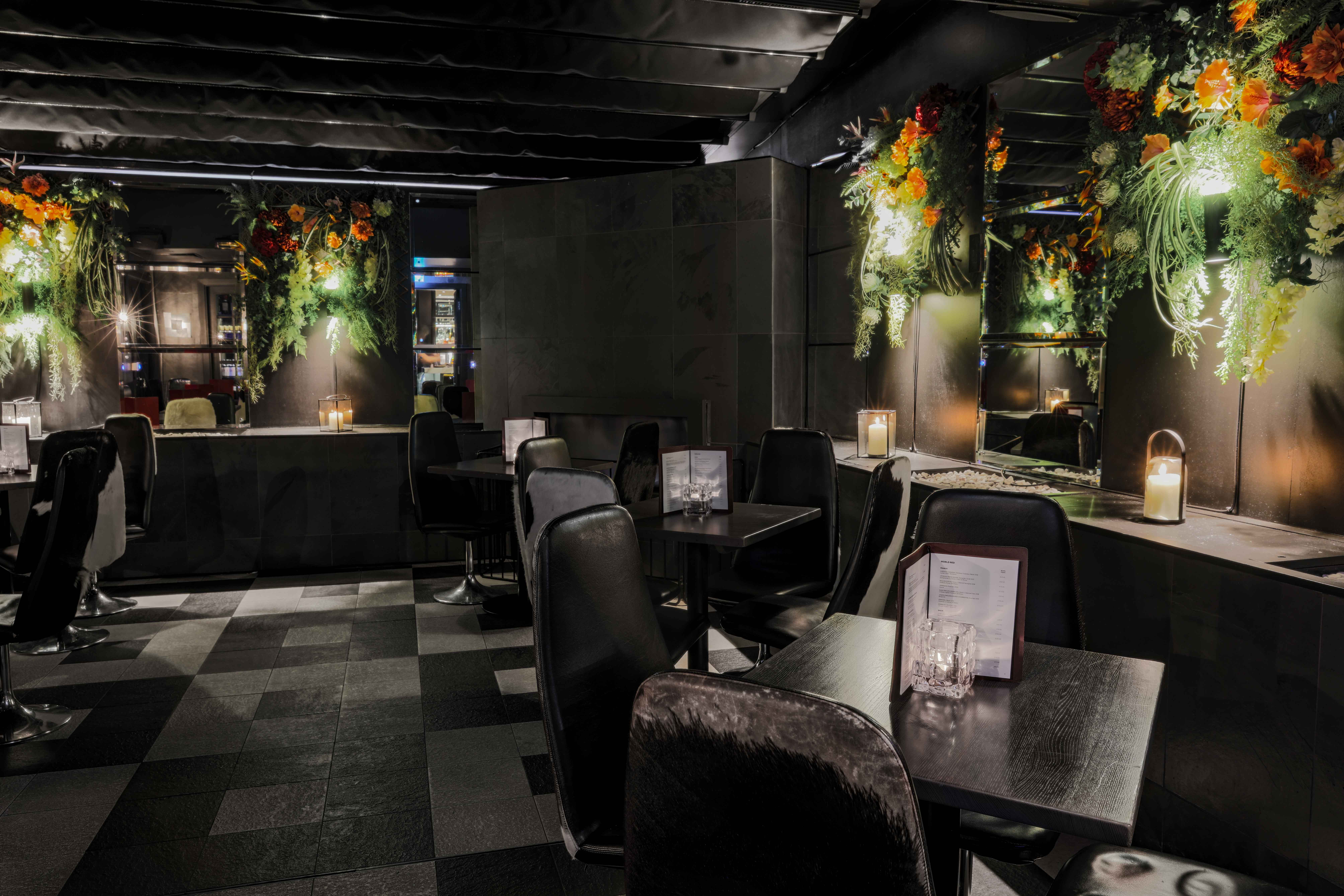 Stylish event space at Gaucho Piccadilly with elegant seating and floral decor.