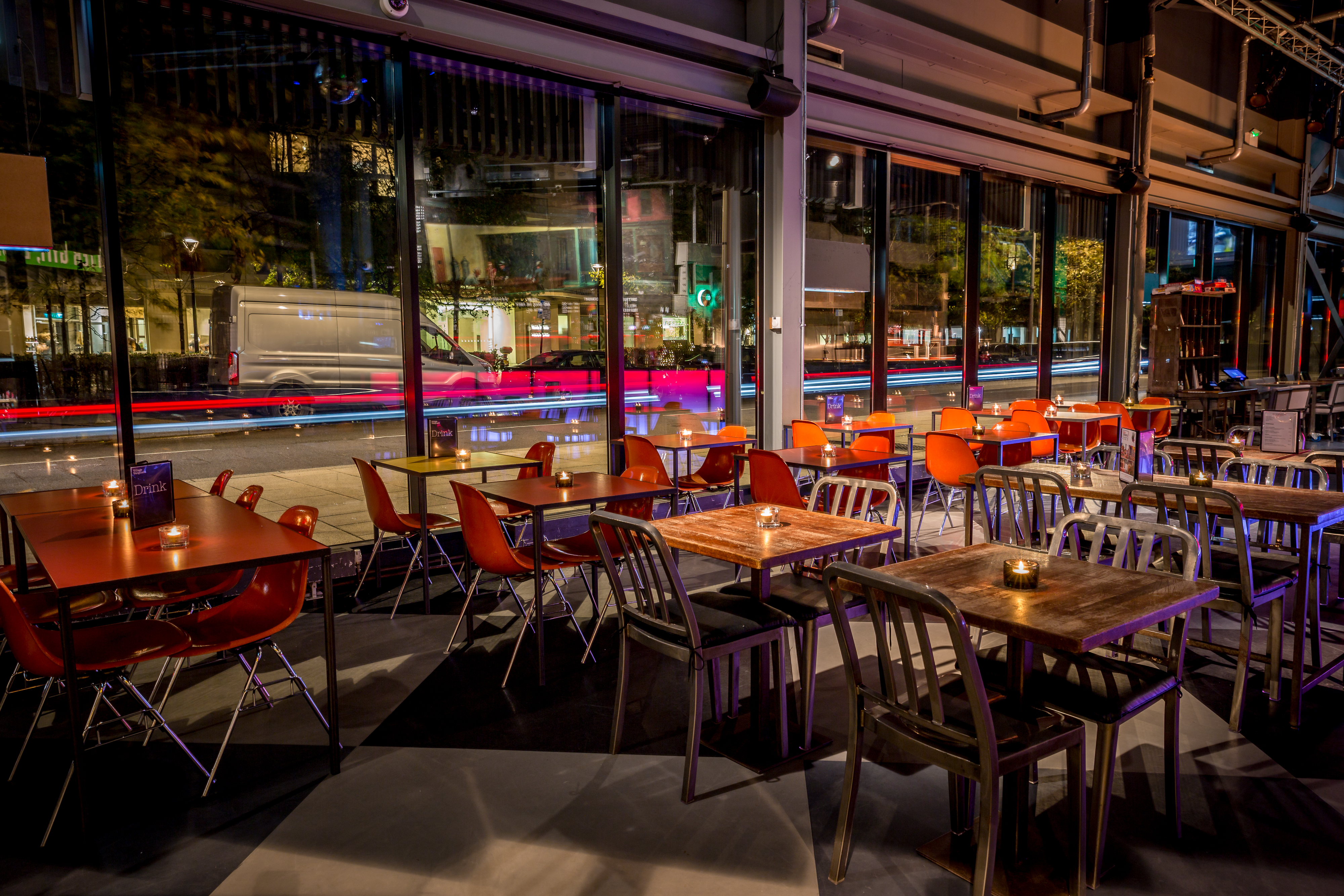 Modern event space in Village Vanguard with sleek tables for networking gatherings.