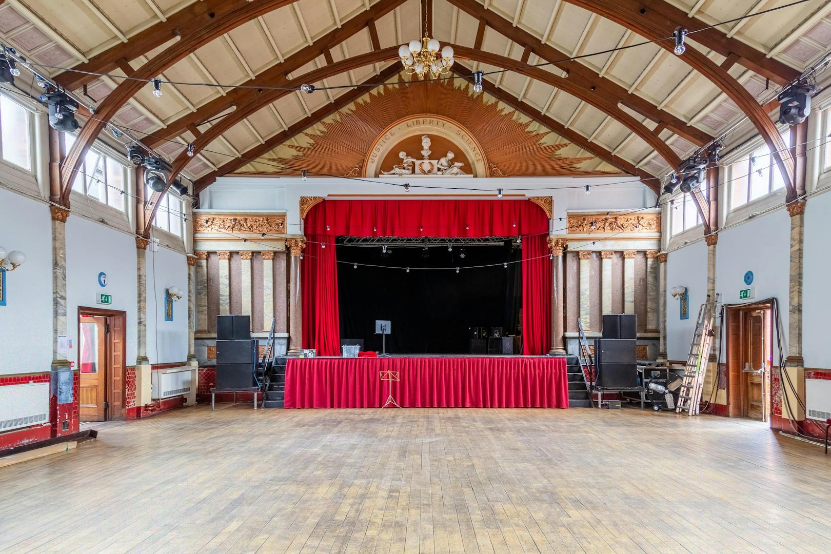Stanley Hall event venue with stage, high ceiling, ideal for conferences and weddings.