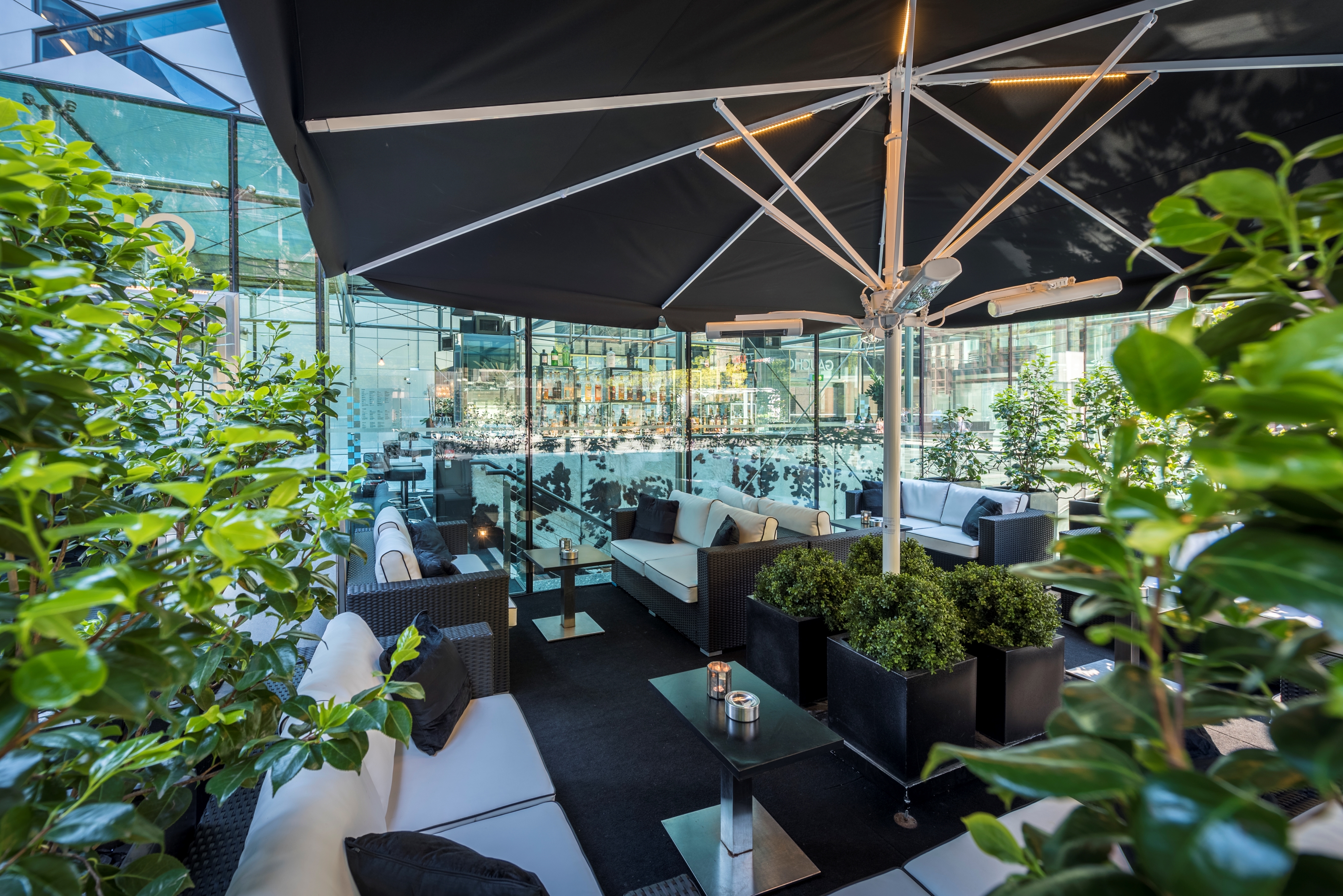 Stylish outdoor lounge at The Glasshouse Bar, perfect for networking events and cocktail receptions.