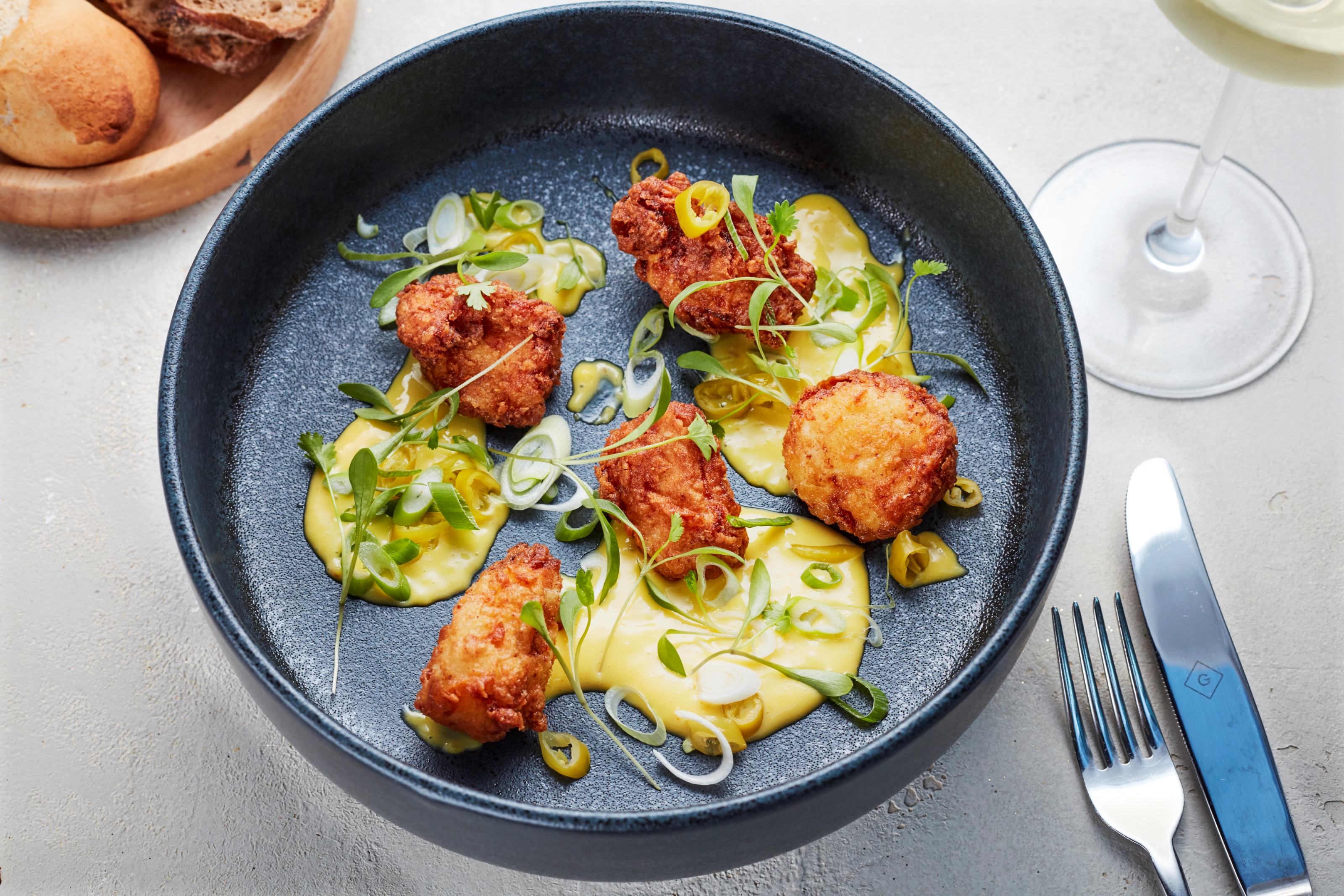 Elegant dish with crispy fried items, perfect for upscale dining and events at Gaucho Piccadilly.