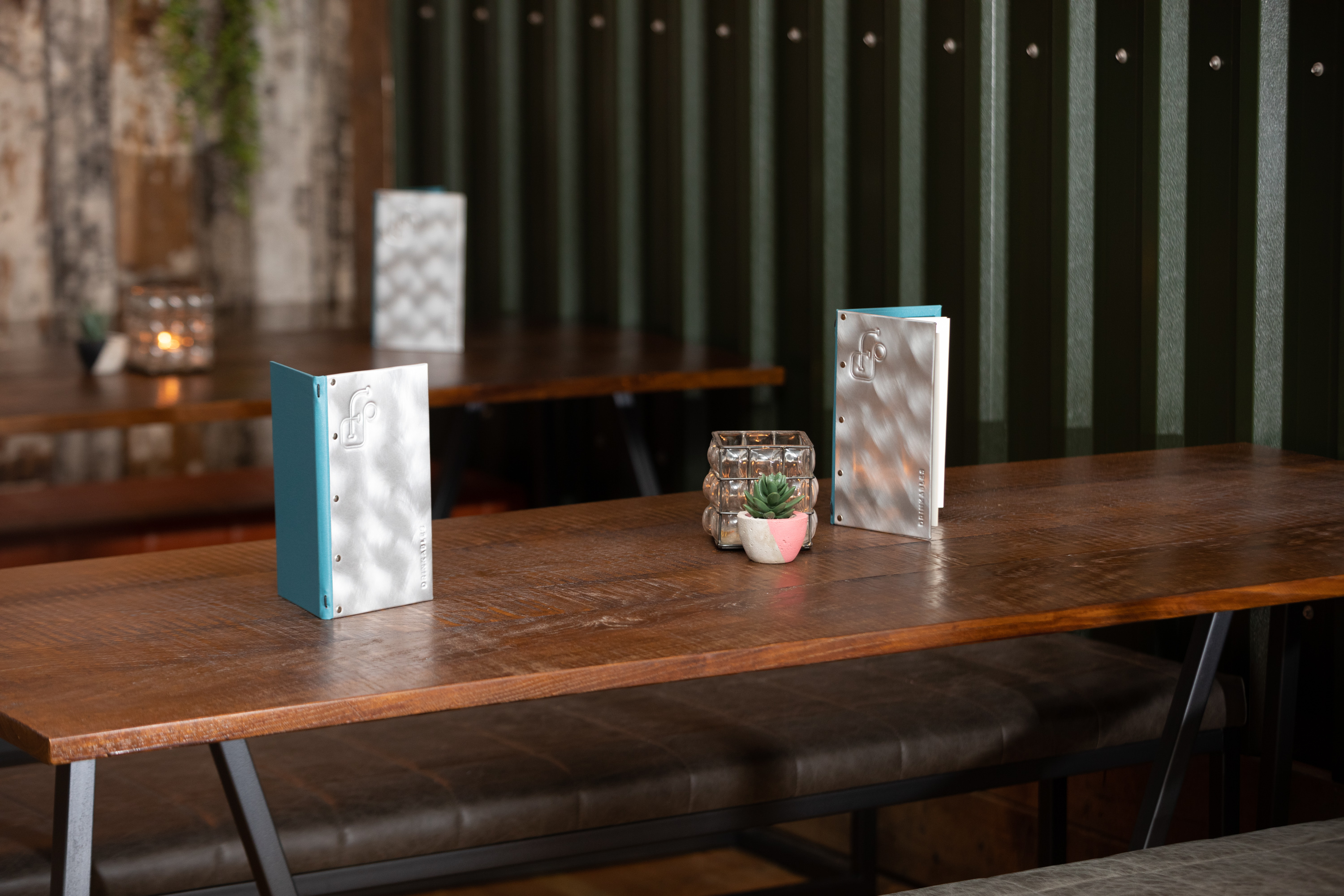 Well-arranged meeting table with rustic decor in Foundry Project restaurant.