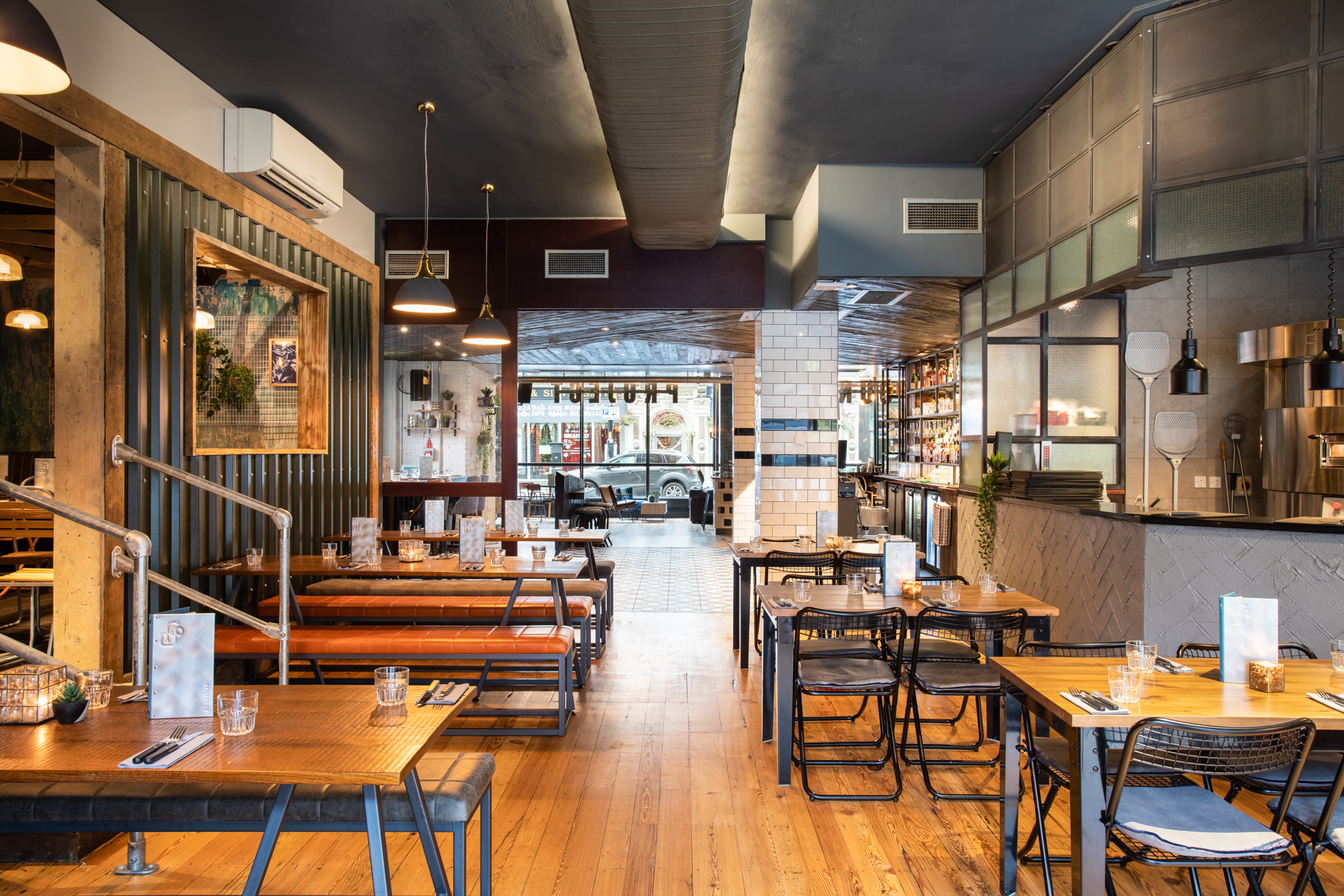 Modern restaurant space with cozy seating for intimate meetings and small events.