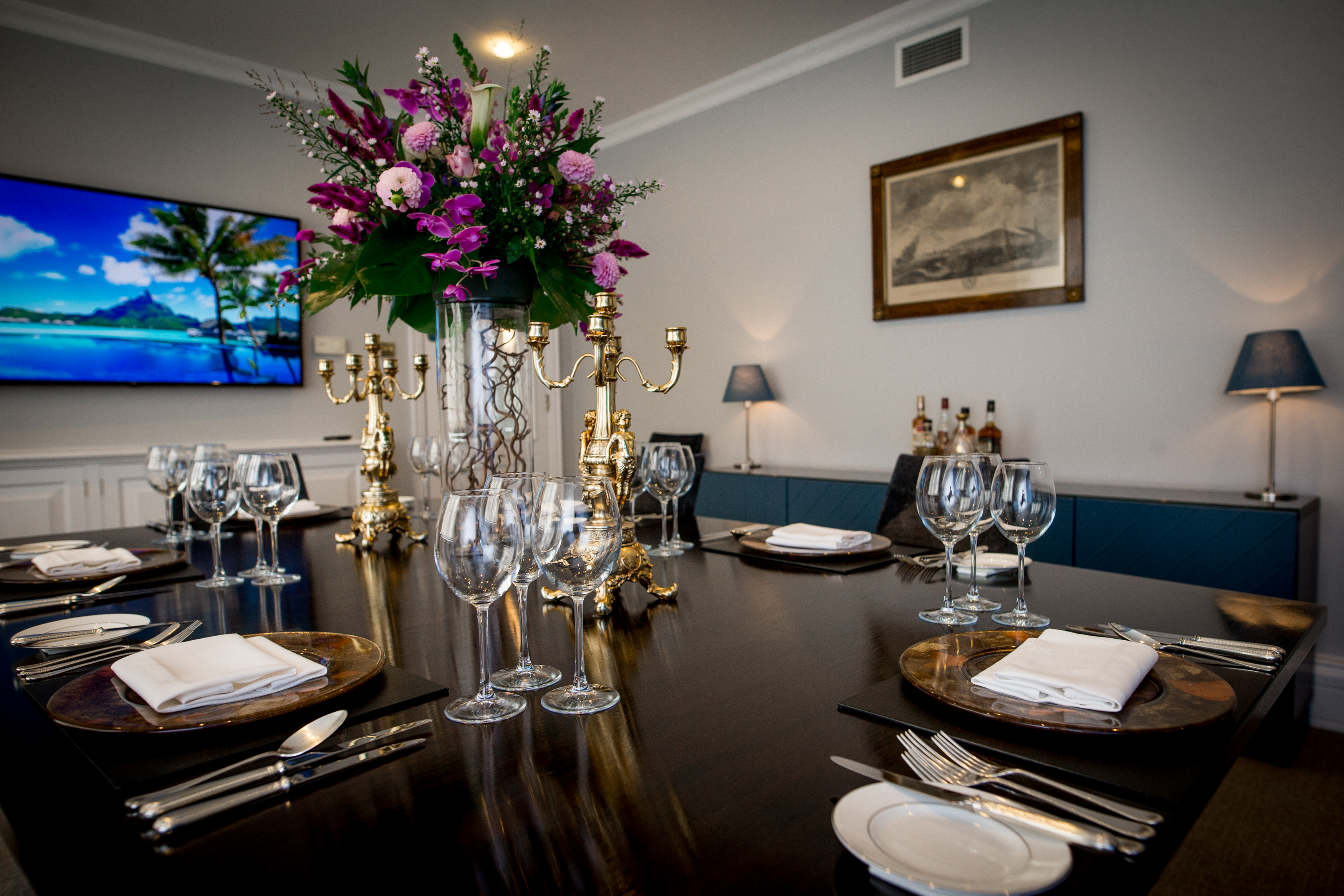 Thames Room at Arundel House, elegant meeting space with floral centerpiece for events.