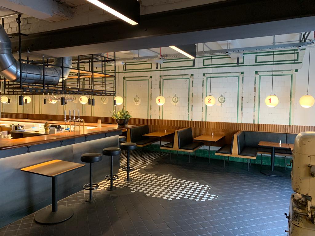 Modern venue in Hoxton with cozy booths, perfect for intimate gatherings and meetings.