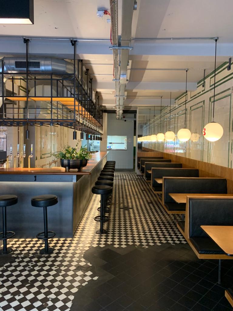 Modern venue in Hoxton with cozy seating, ideal for intimate meetings and events.