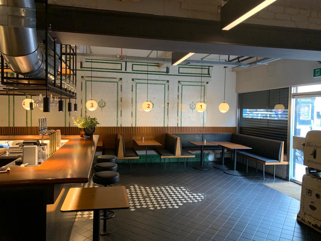 Versatile event space in Hoxton with cozy seating, ideal for networking and workshops.