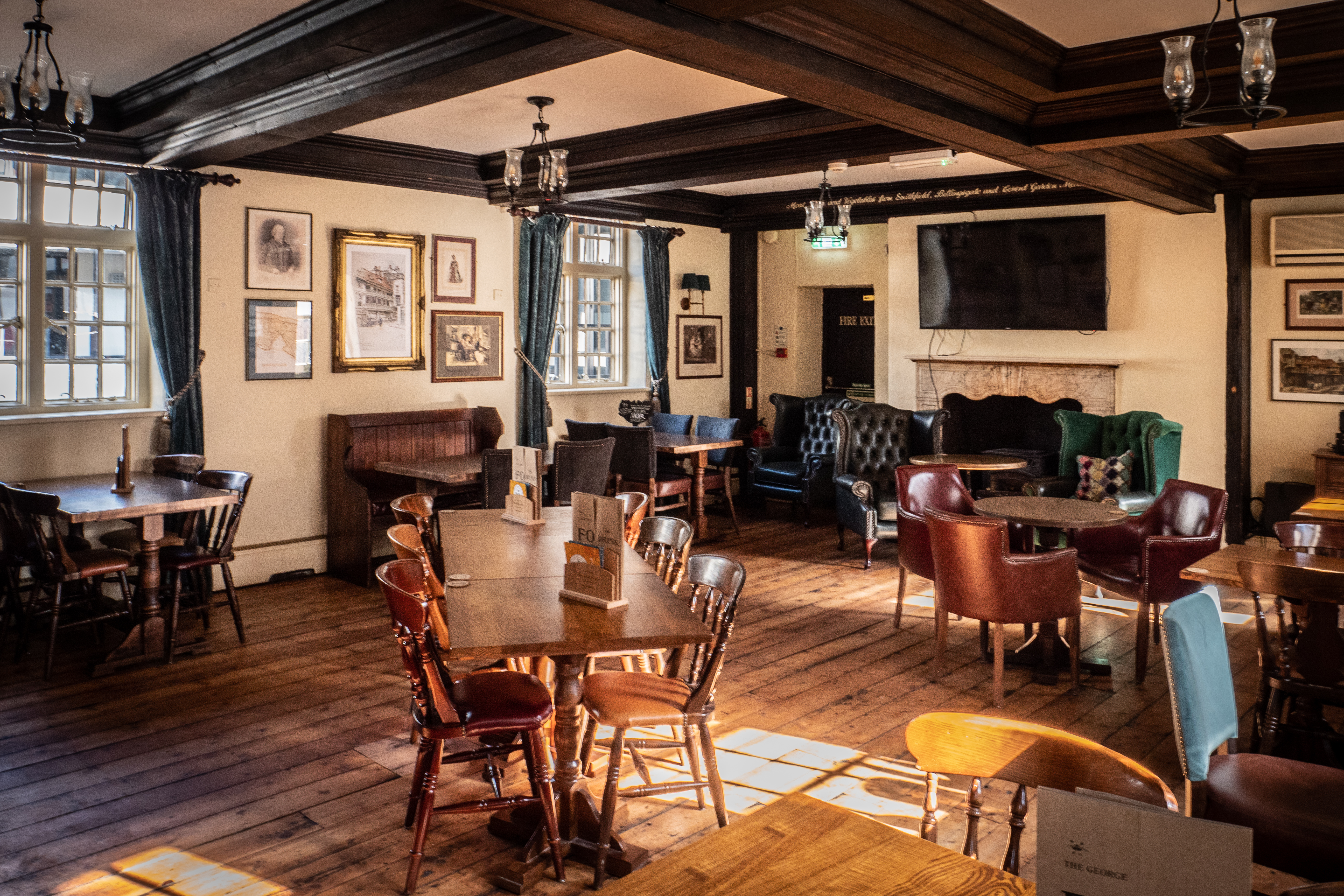 Charming venue at Greene King - The George Inn, ideal for intimate gatherings and meetings.