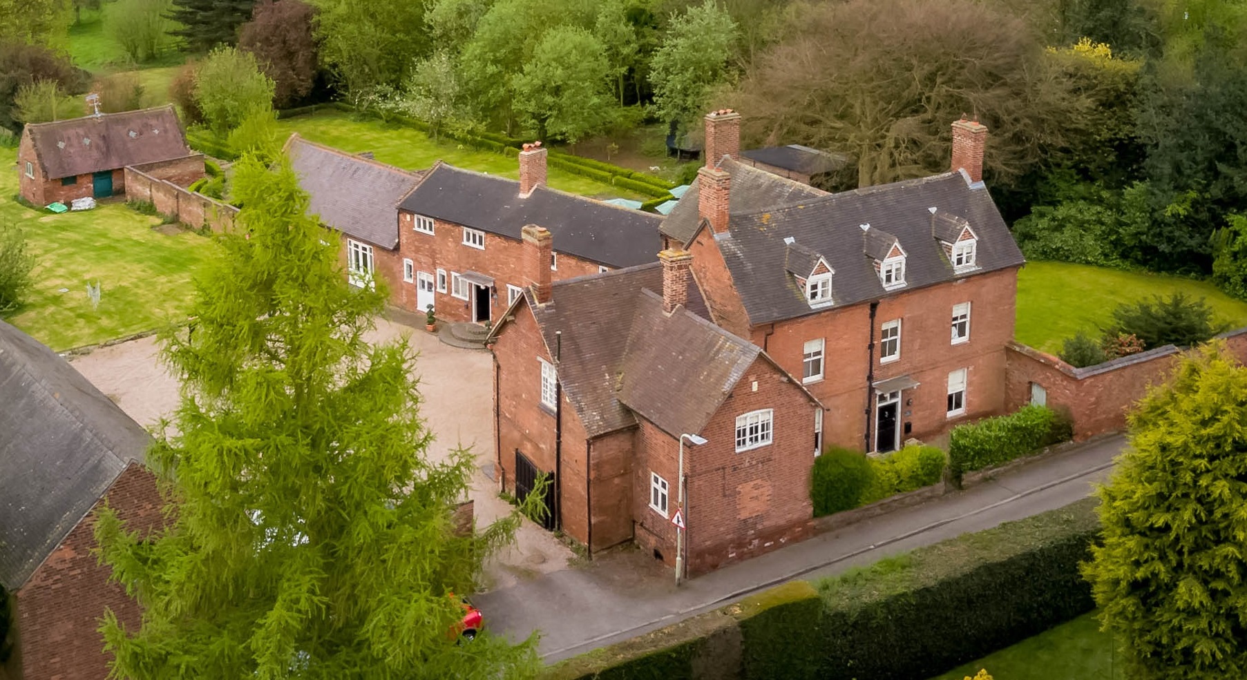 Private luxury estate venue with rustic architecture for intimate gatherings and corporate retreats.