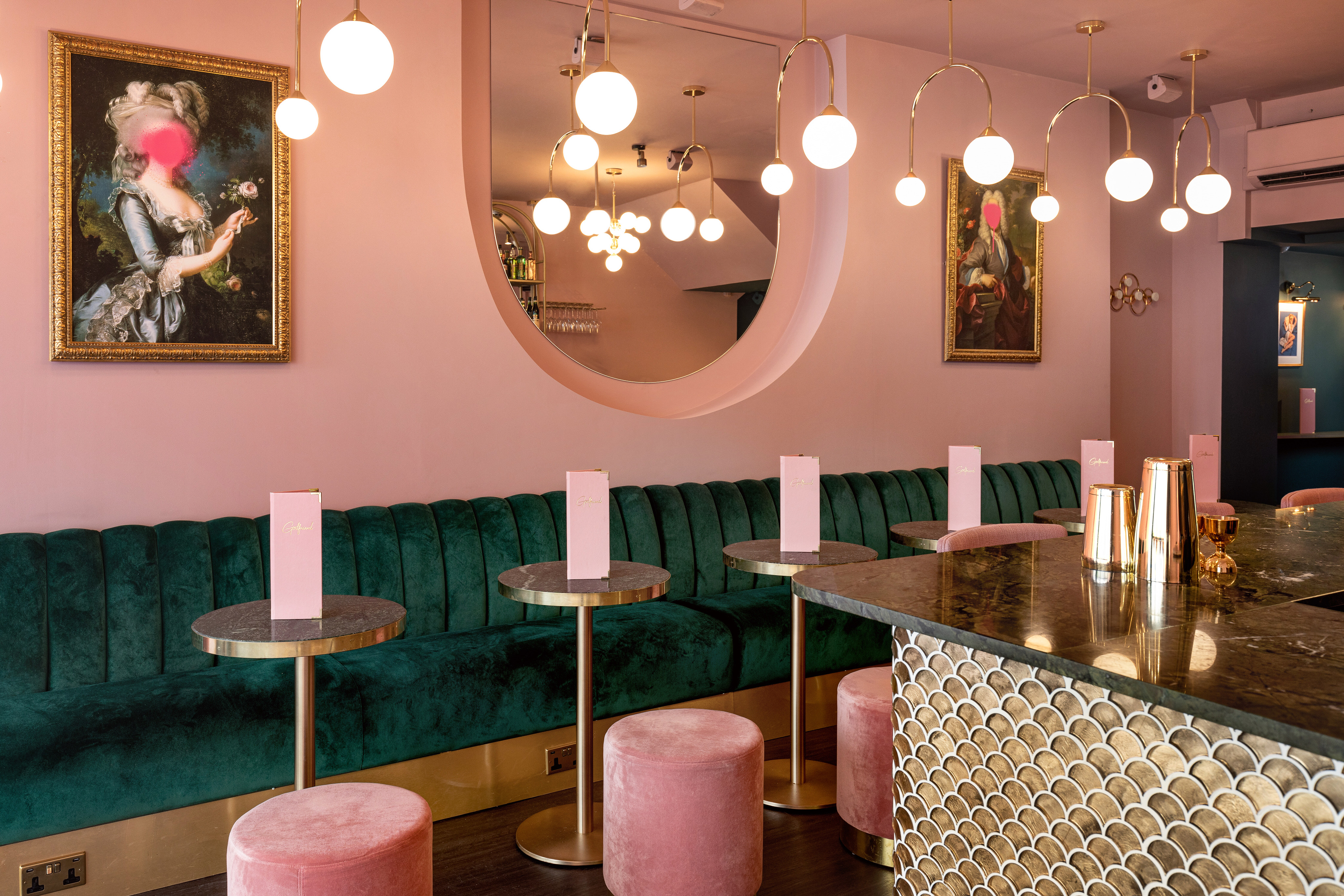 Stylish event space with plush green seating for intimate gatherings in Clapham.