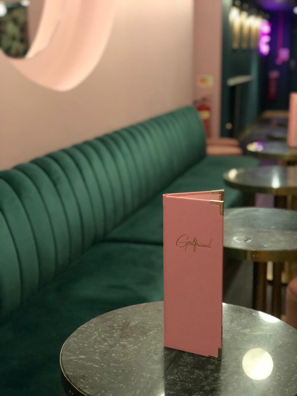 Stylish lounge with plush green seating for networking events in Girlfriend Clapham.