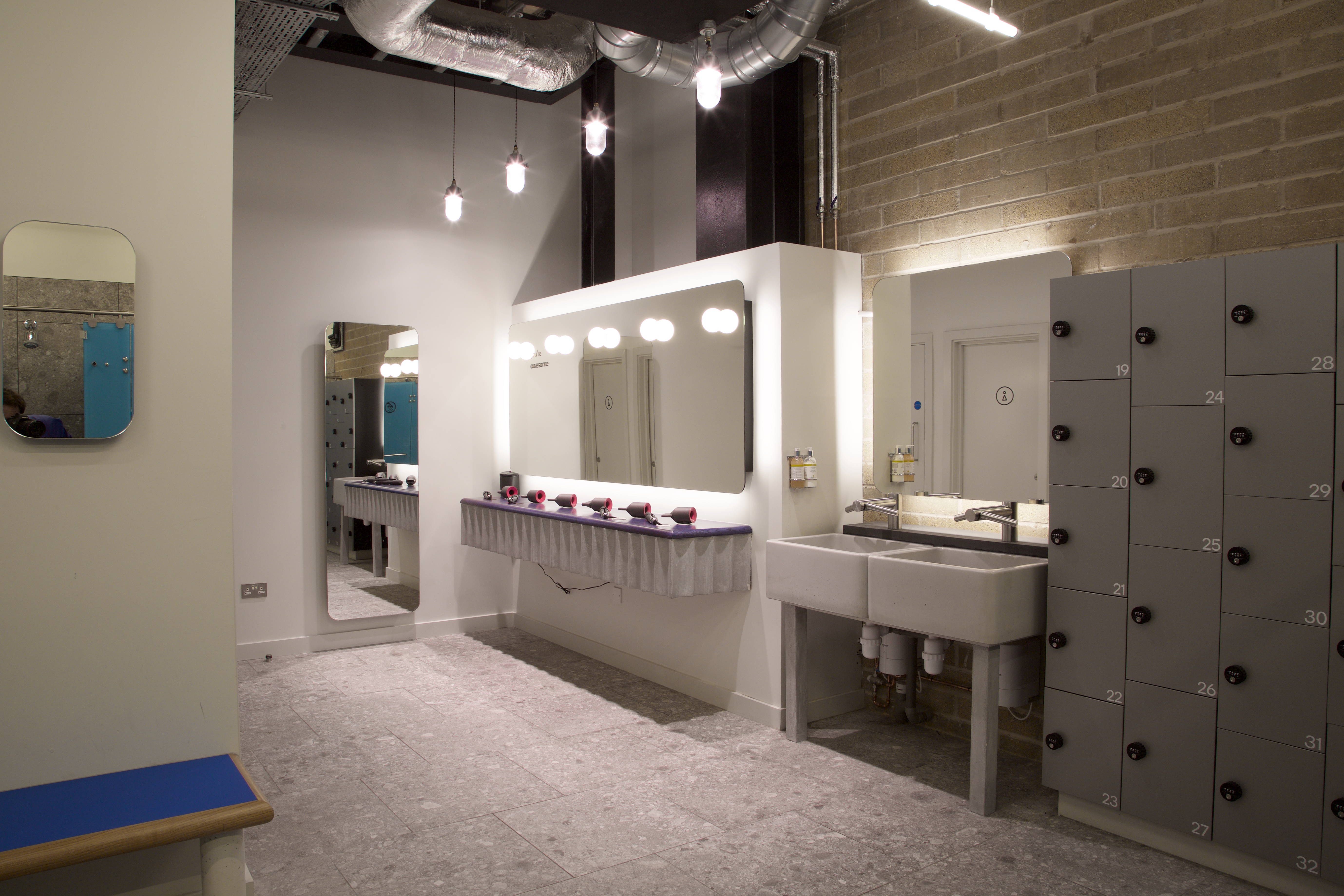 Reception area with mirrors and lockers, perfect for events and meetings at Boom Cycle Hammersmith.