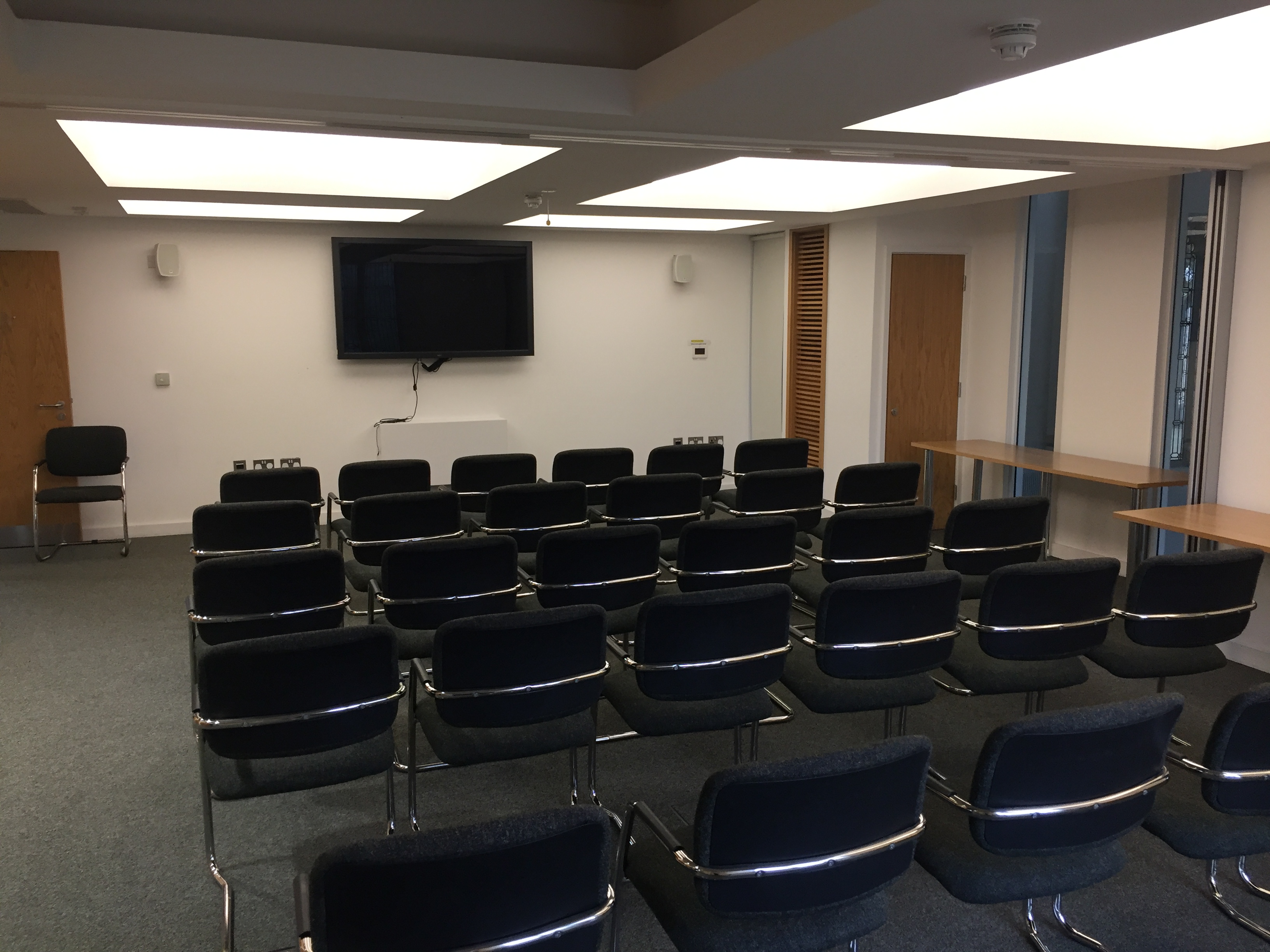 Anchor Room in St Barnabas Church Centre, organized for a seminar with multimedia setup.