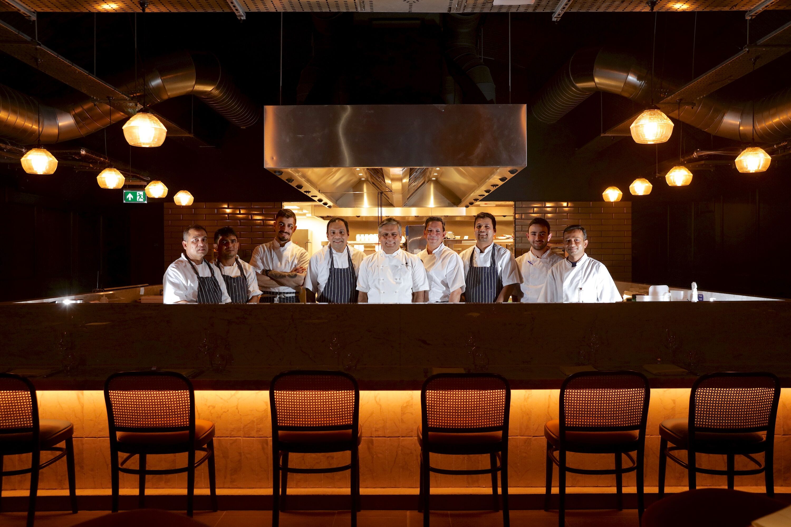 Professional kitchen team at Cinnamon Kitchen Battersea, ideal for event catering experiences.