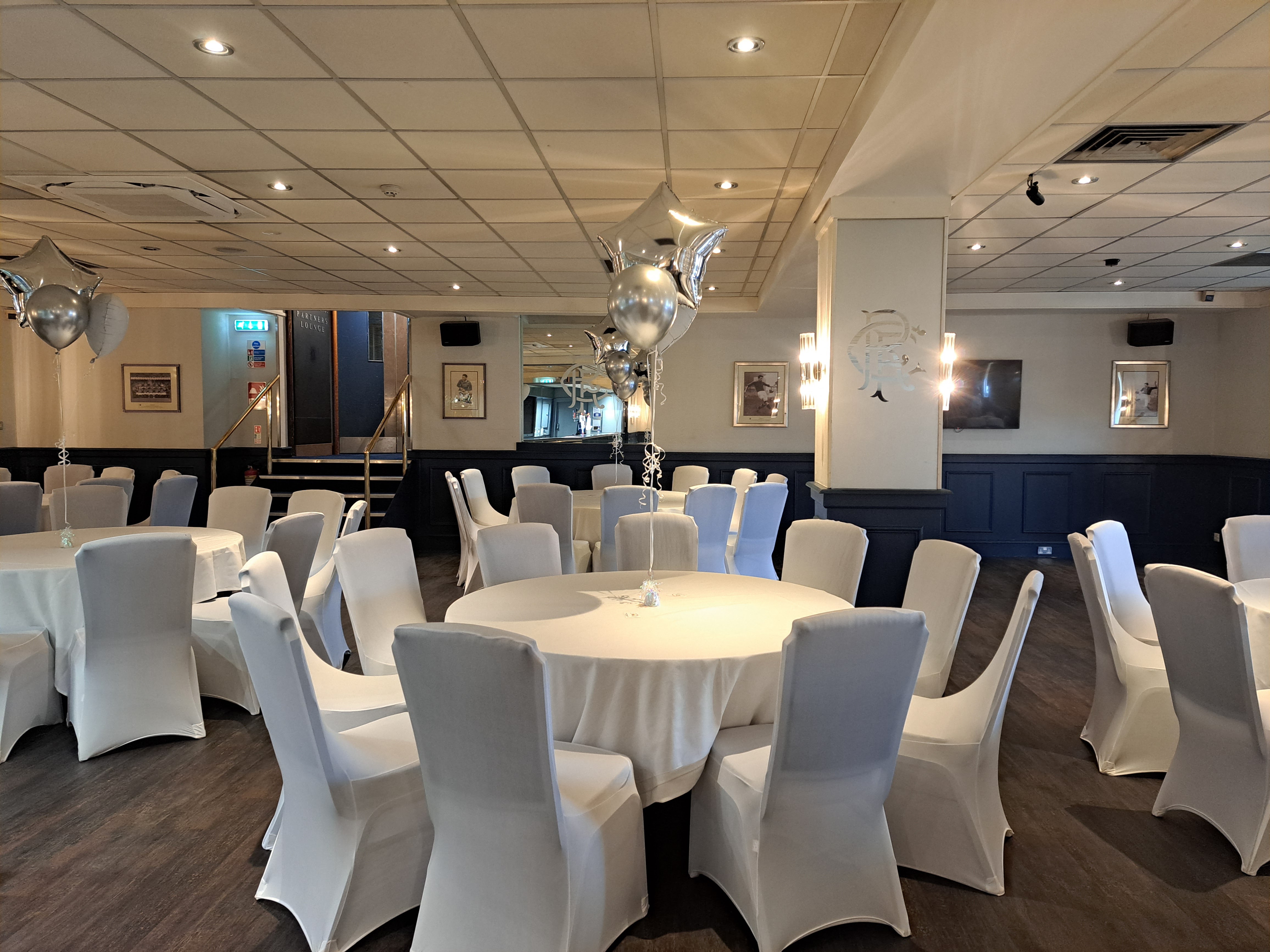 Thornton Suite at Rangers FC: elegant event space with round tables for corporate meetings.
