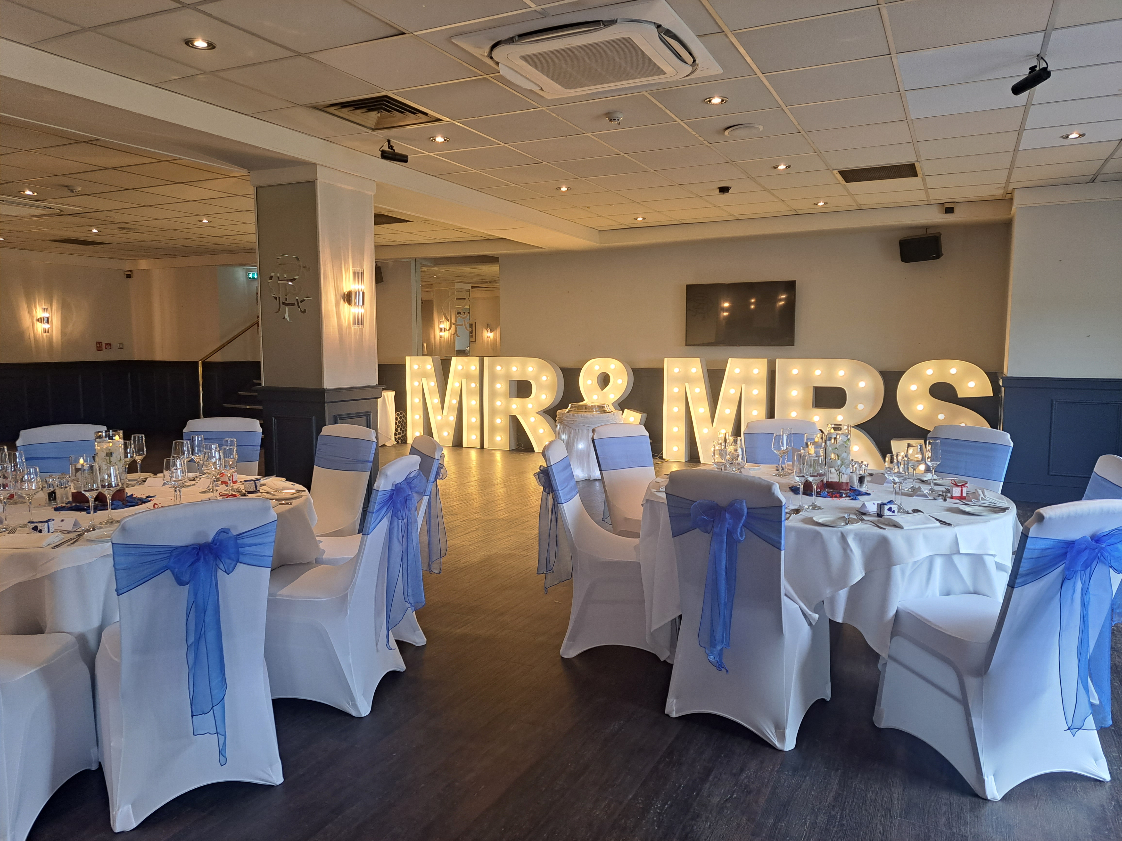 Elegant Thornton Suite at Rangers FC, perfect for wedding receptions with stunning decor.