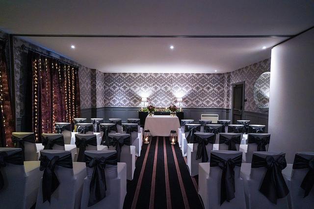 Elegant wedding venue MAL THREE in Malmaison Edinburgh with satin bow chairs.