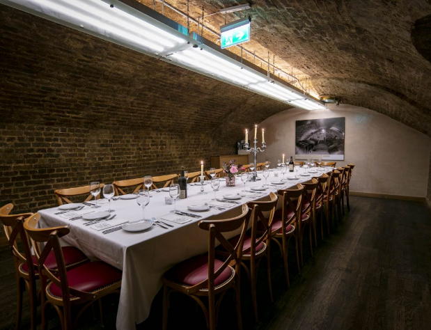 Elegant dining table in rustic George Sandeman Room, ideal for intimate gatherings.