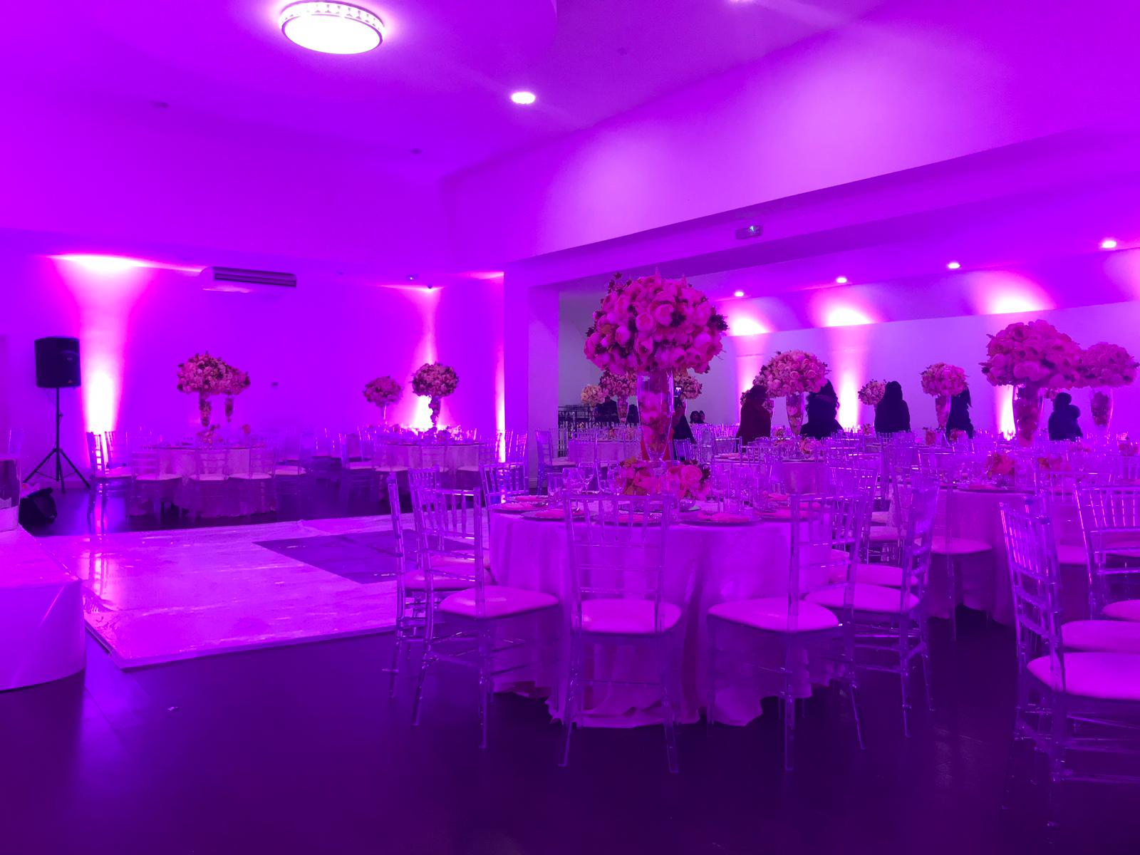 Elegant Mayfair Lounge with purple lighting, perfect for weddings and upscale events.