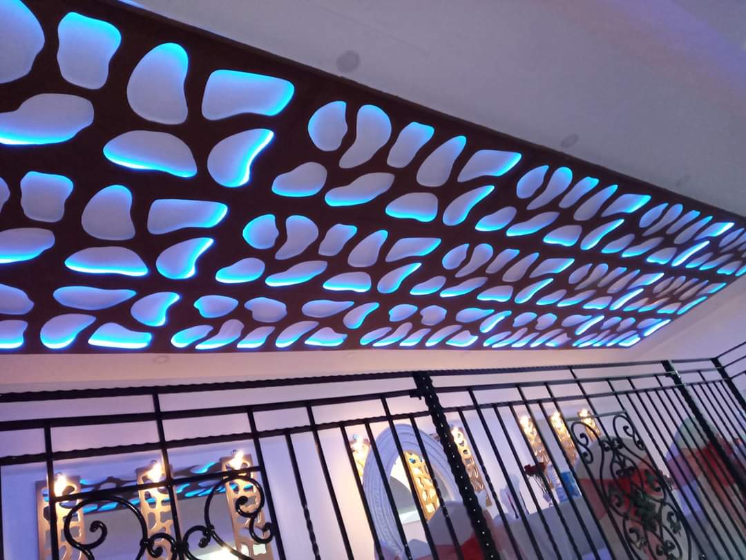 Mayfair Lounge ceiling with organic pattern and blue lighting, perfect for events.