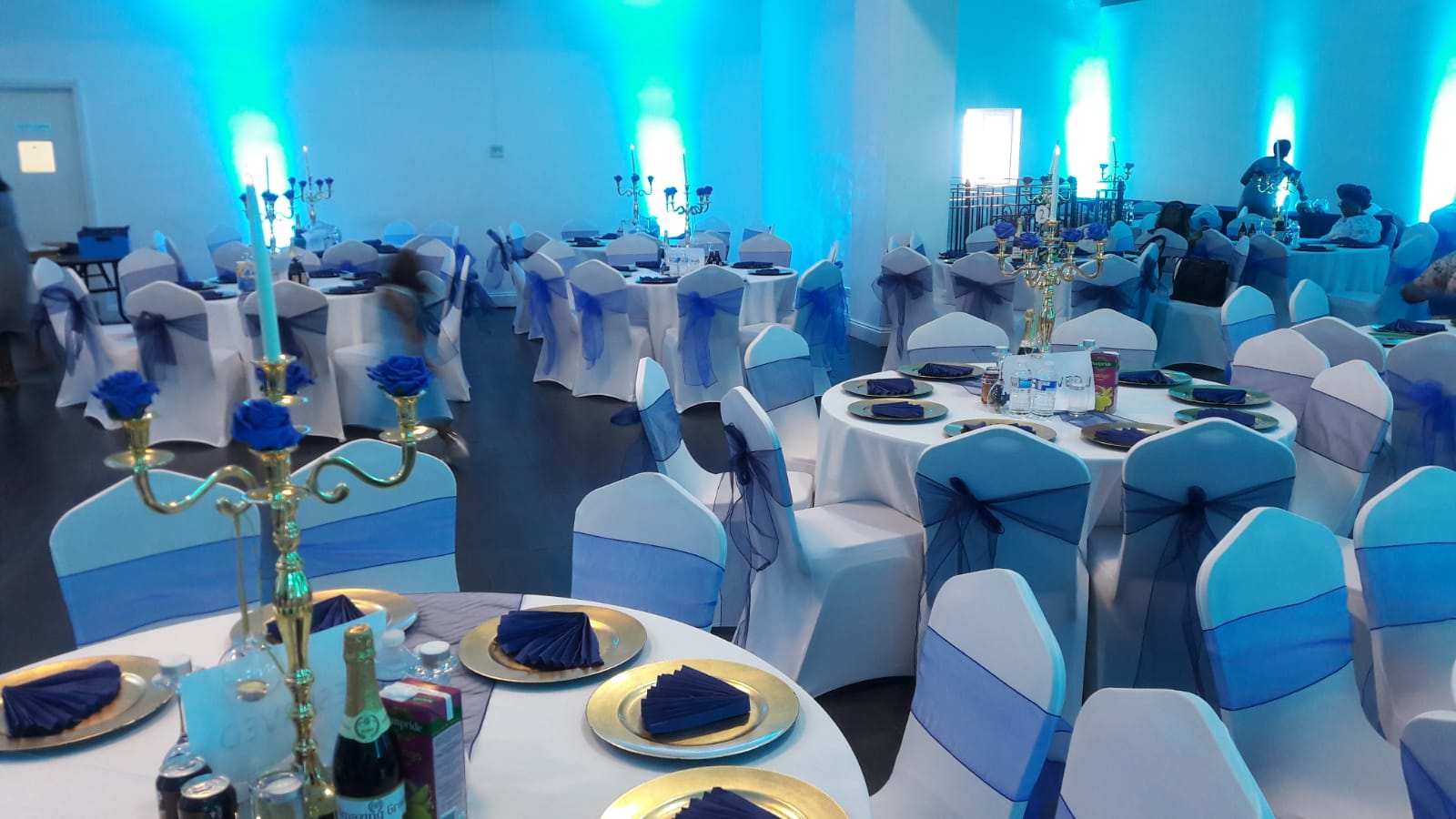 Elegant Mayfair Lounge event space with blue accents, perfect for formal celebrations.