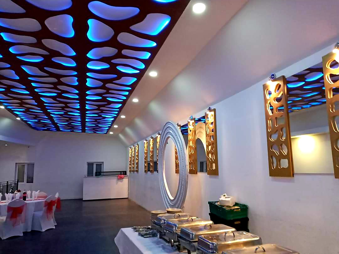 Modern Mayfair Lounge with blue-lit ceiling, perfect for banquets and receptions.