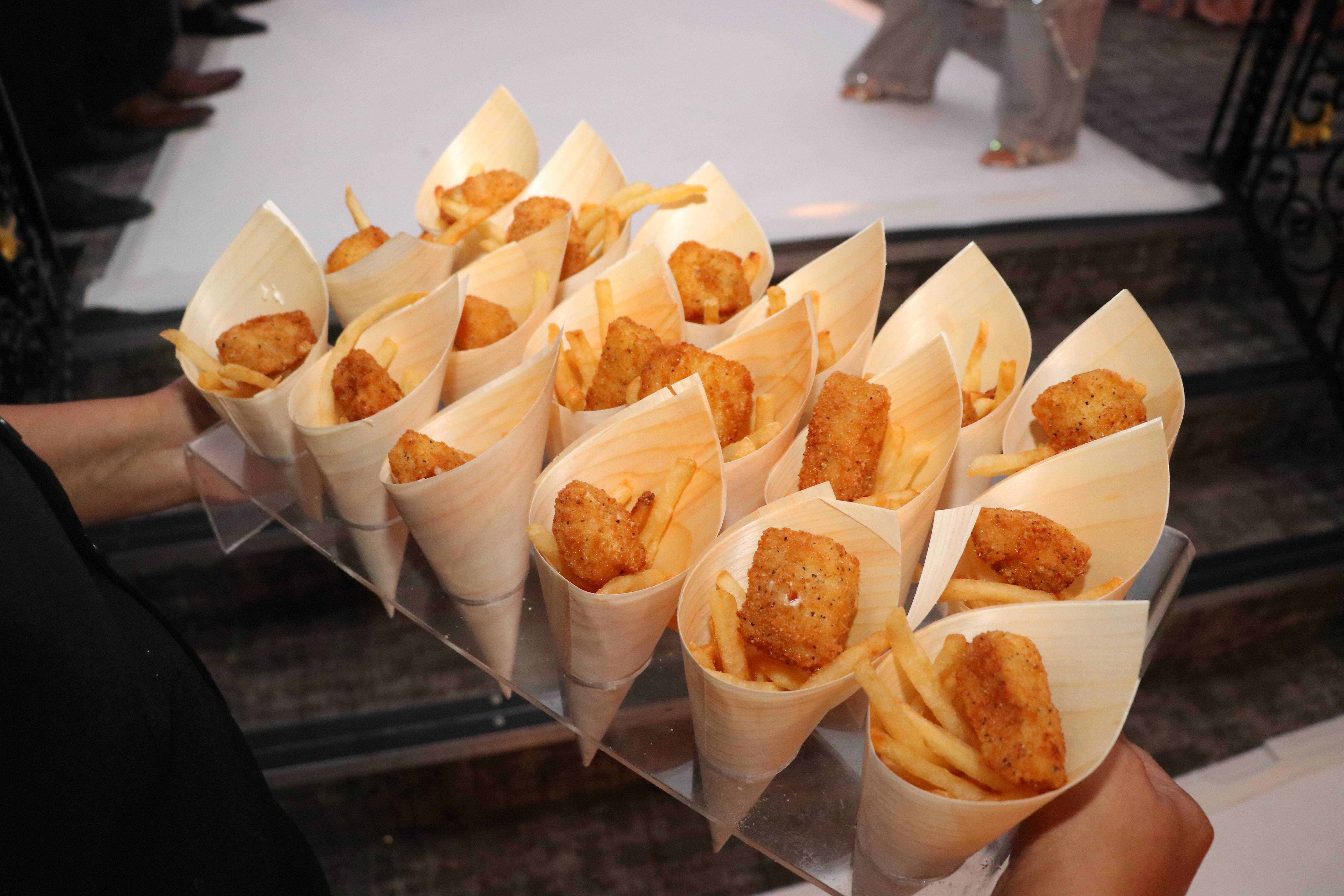 Elegant Grand Ballroom with crispy chicken bites and fries for event catering.