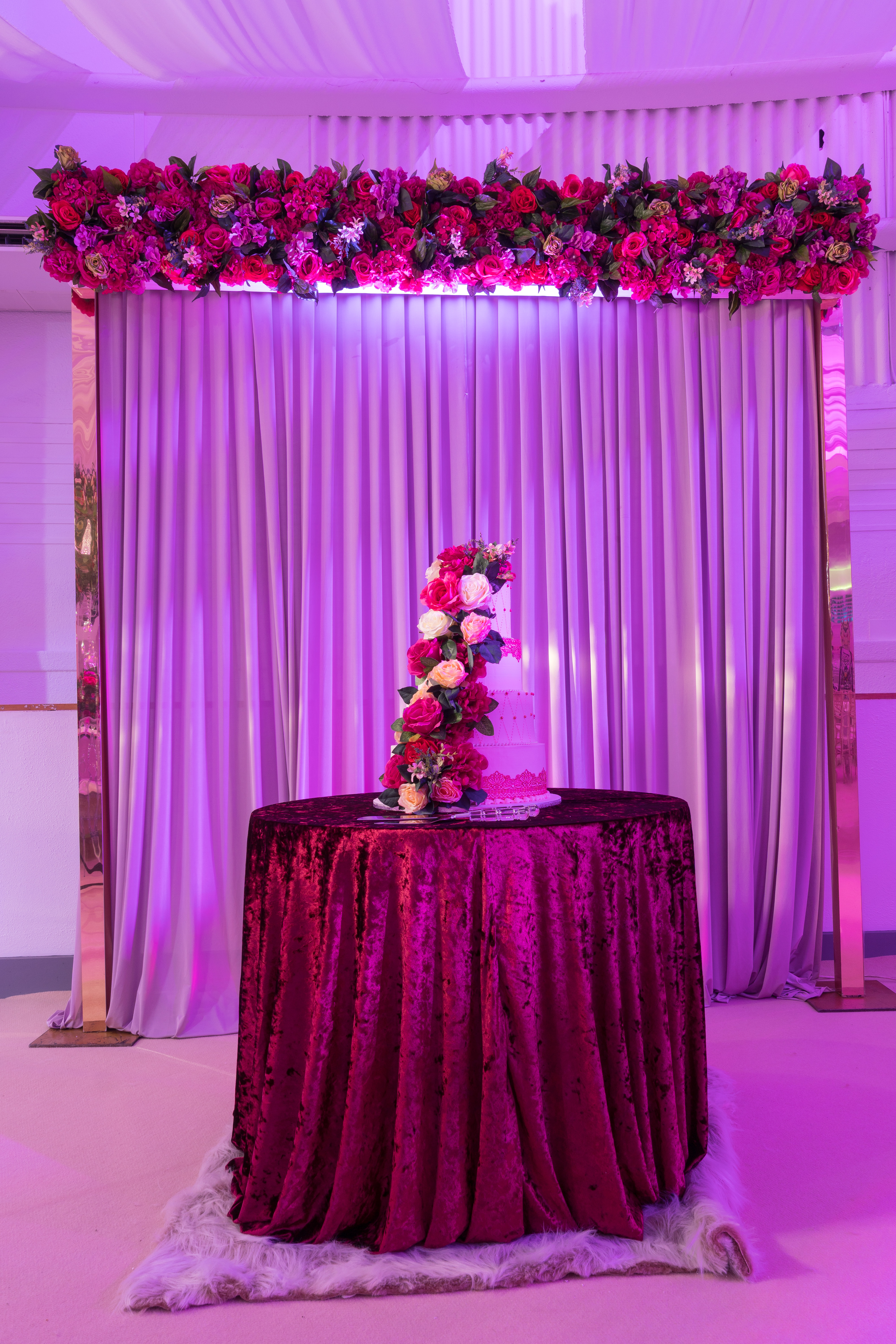 Elegant tiered cake display in Mayfair's Grand Ballroom, perfect for weddings and celebrations.