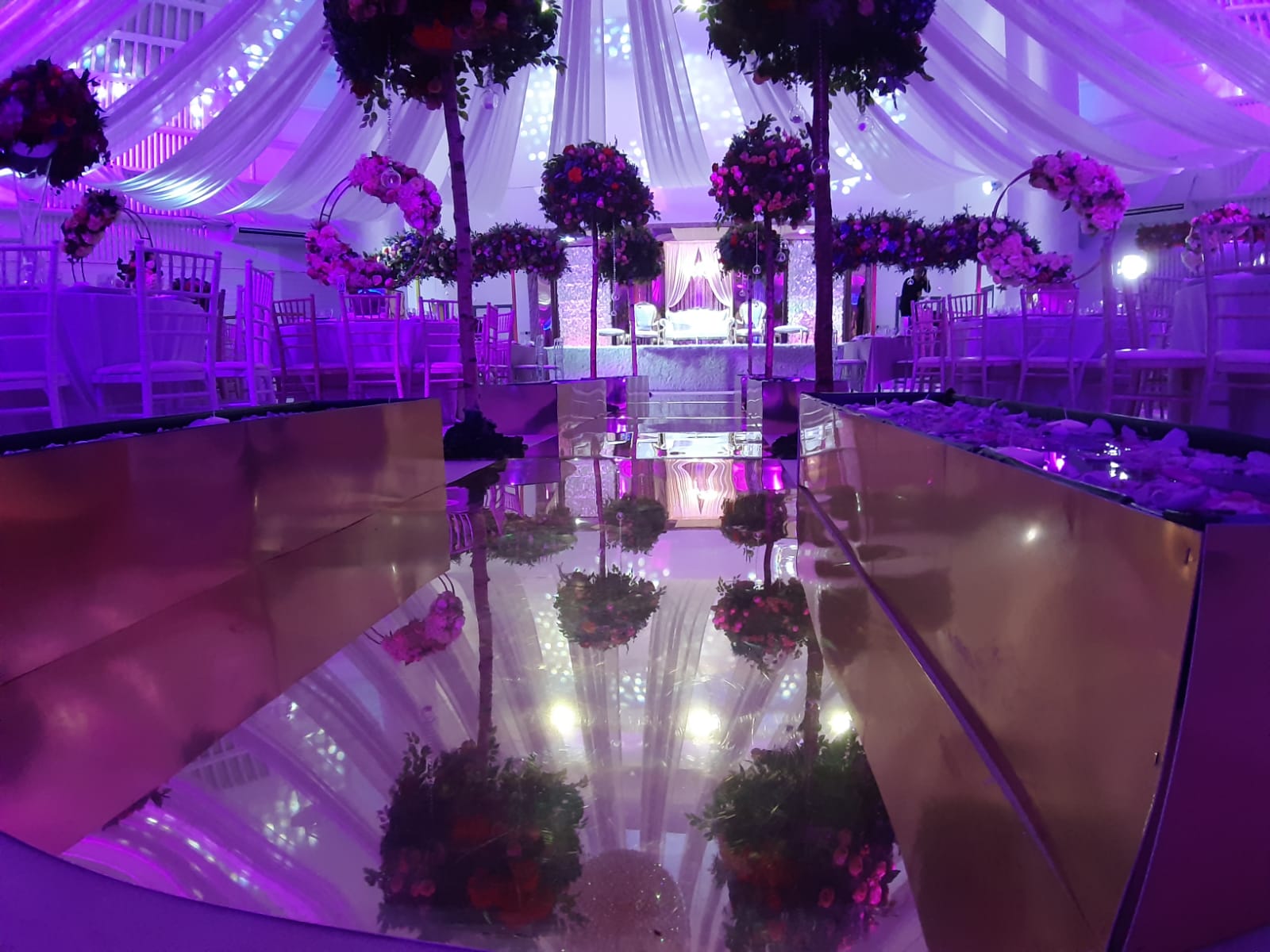 Grand Ballroom at The Mayfair, elegant seating and floral decor for weddings and upscale events.