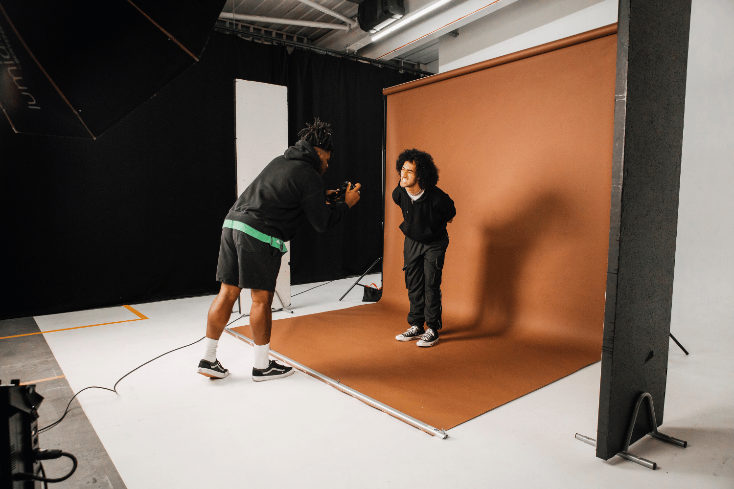 Dynamic photoshoot setup at MAKE IT Bow studio for engaging event marketing visuals.