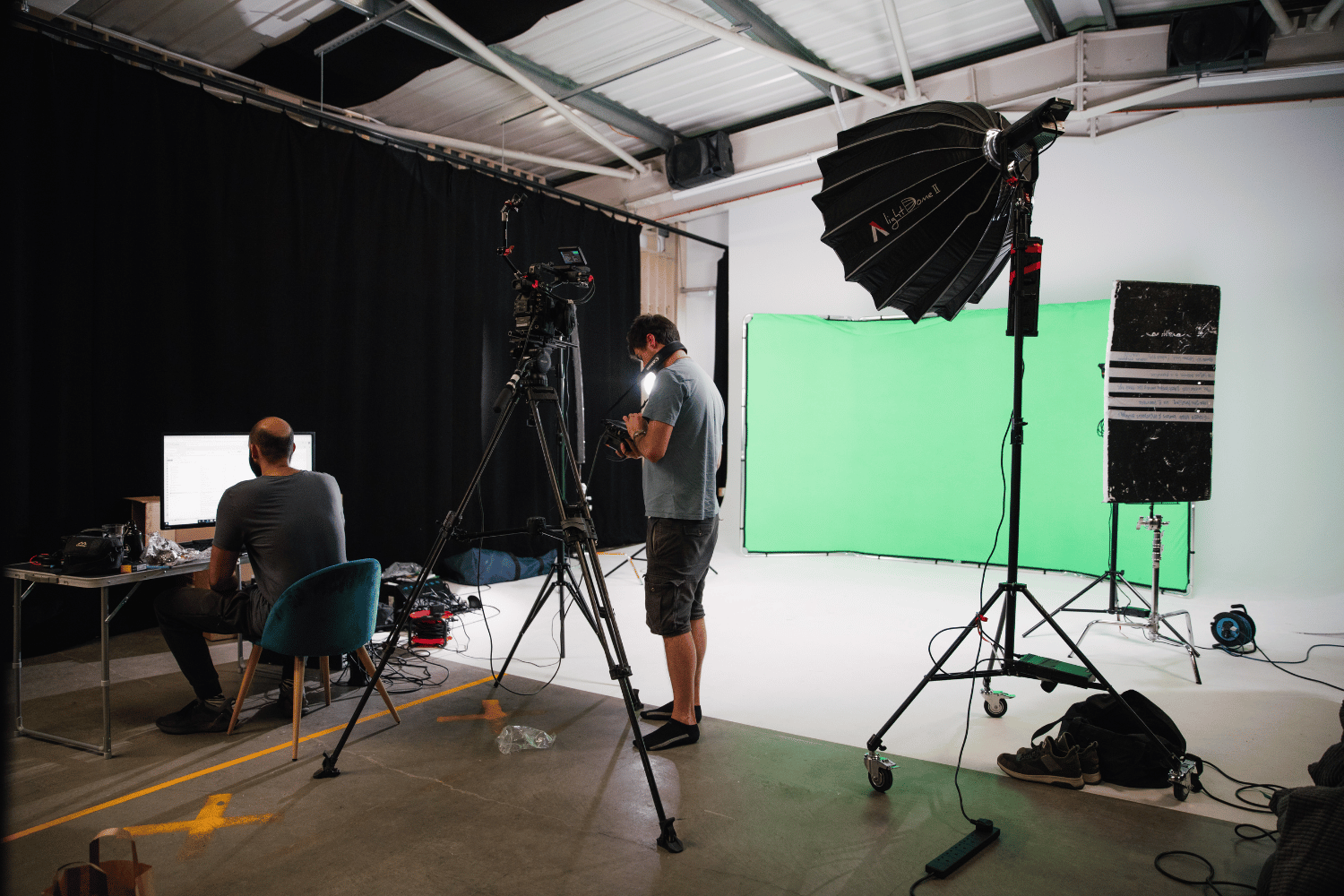 Professional virtual event setup with green screen and lighting at MAKE IT Bow Photography Studio.