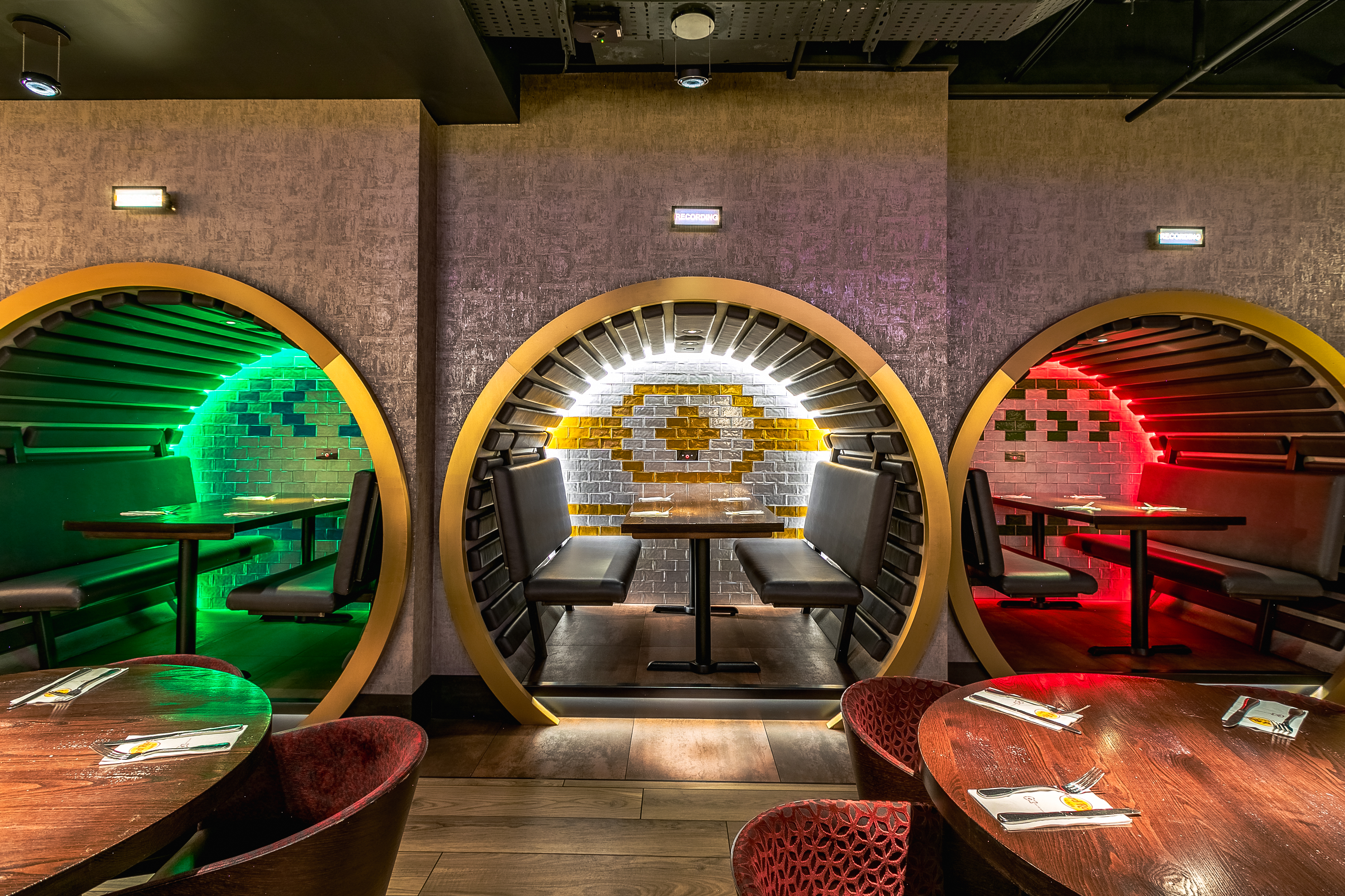 Vibrant dining space with circular booths at Hard Rock Cafe Piccadilly Circus for events.
