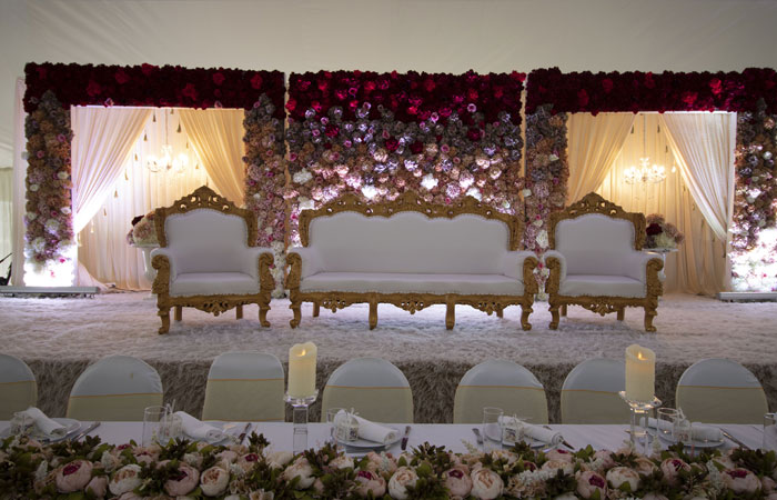 Elegant Mega Marquee with floral backdrops, perfect for weddings and upscale events.