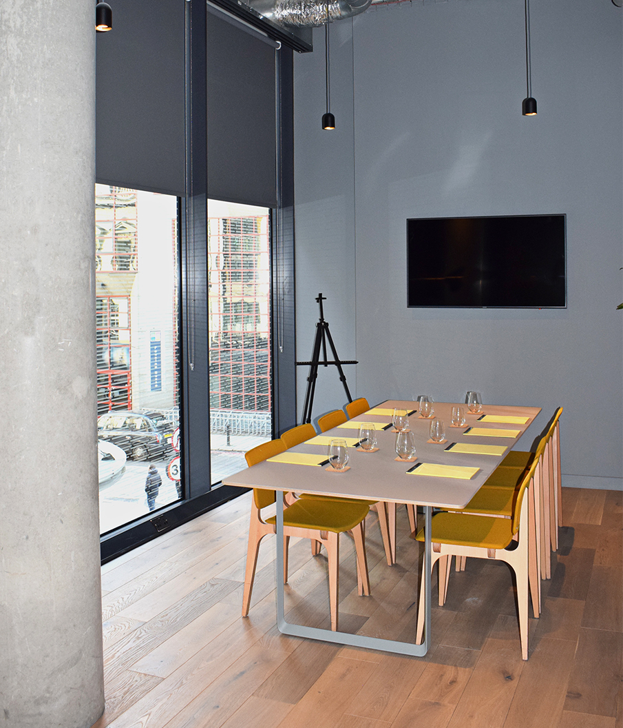 Modern meeting room at Leman Locke with sleek table, ideal for workshops and brainstorming.