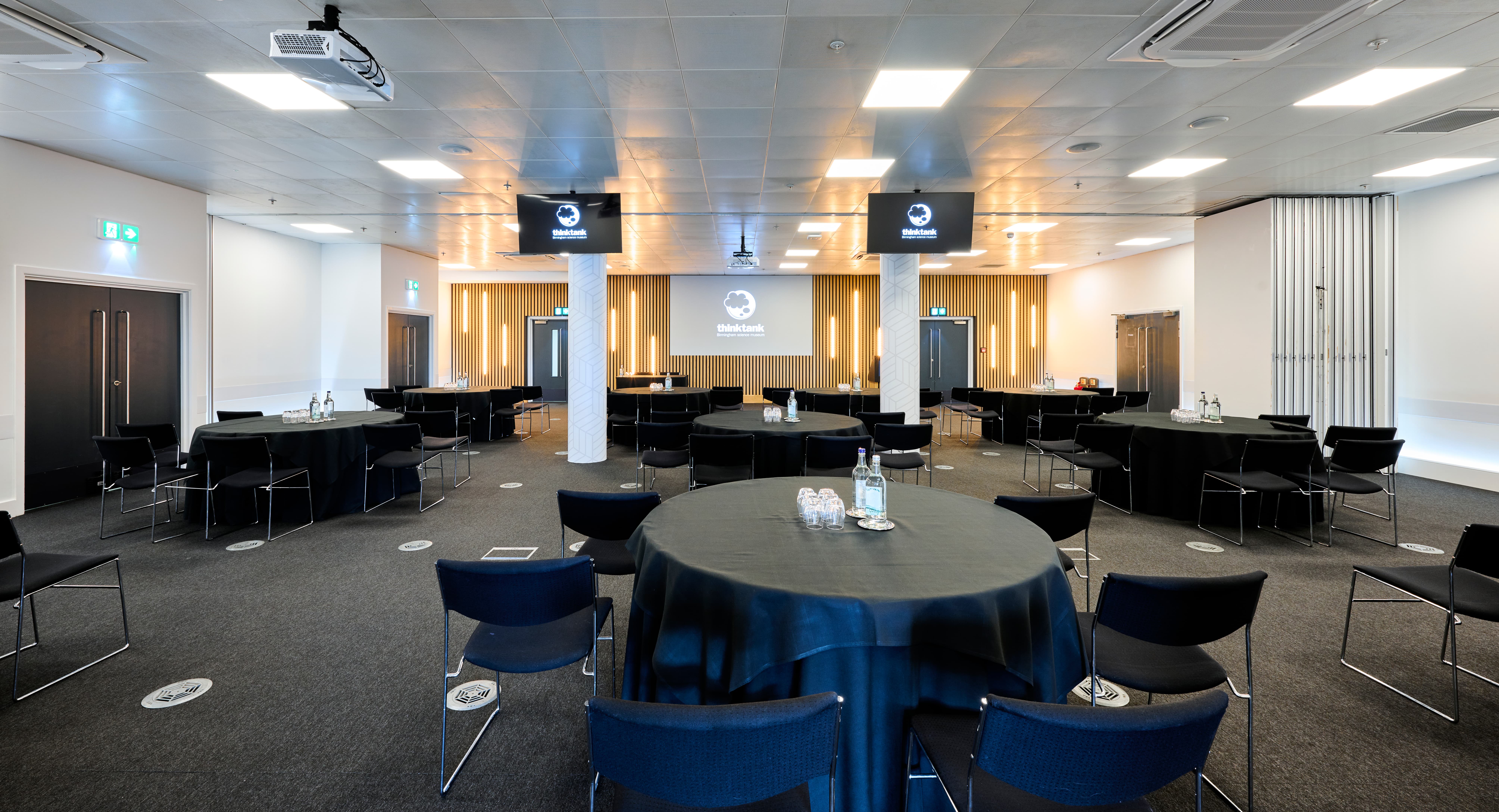 Event Suite banquet setup at Thinktank with AV support, ideal for corporate events and conferences.