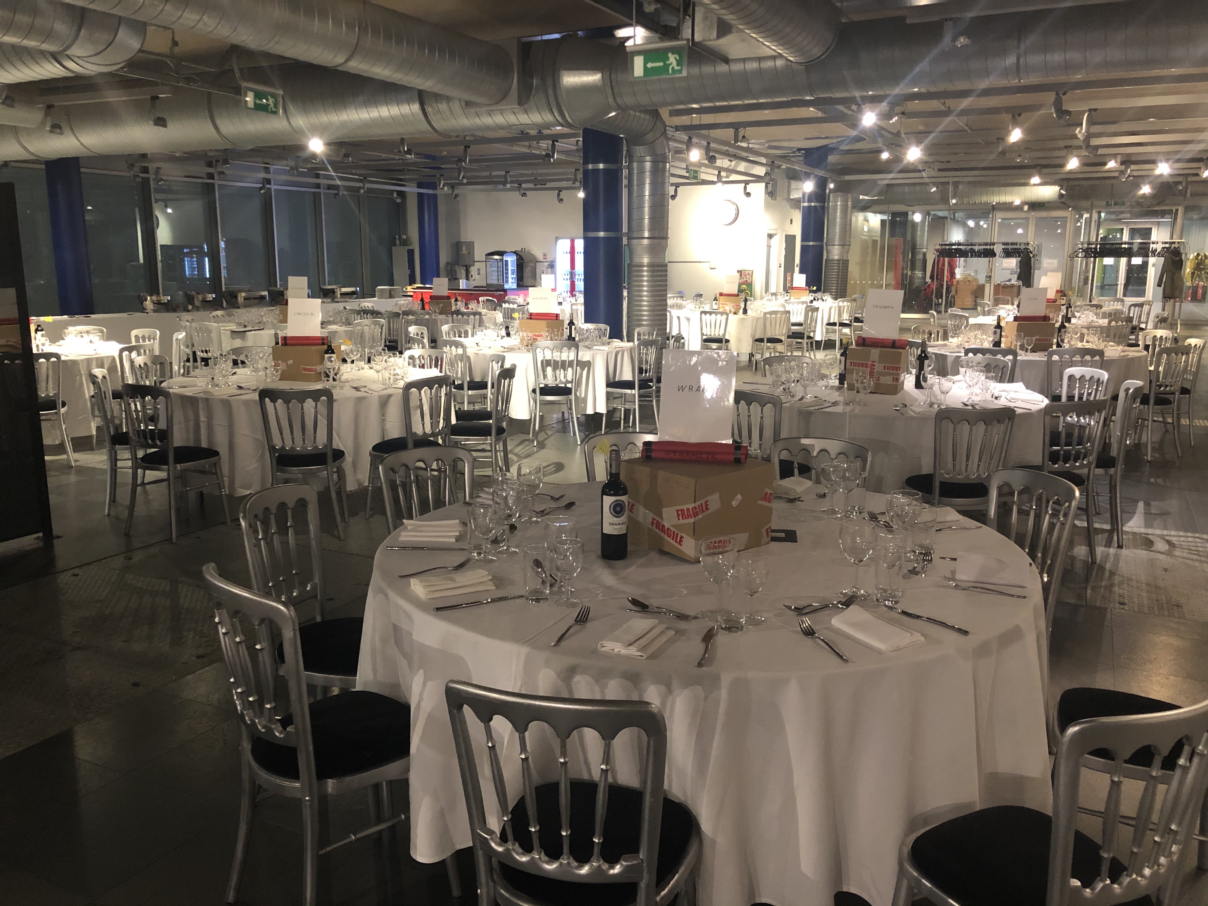 Elegant event space with round tables, perfect for formal dinners and galas.