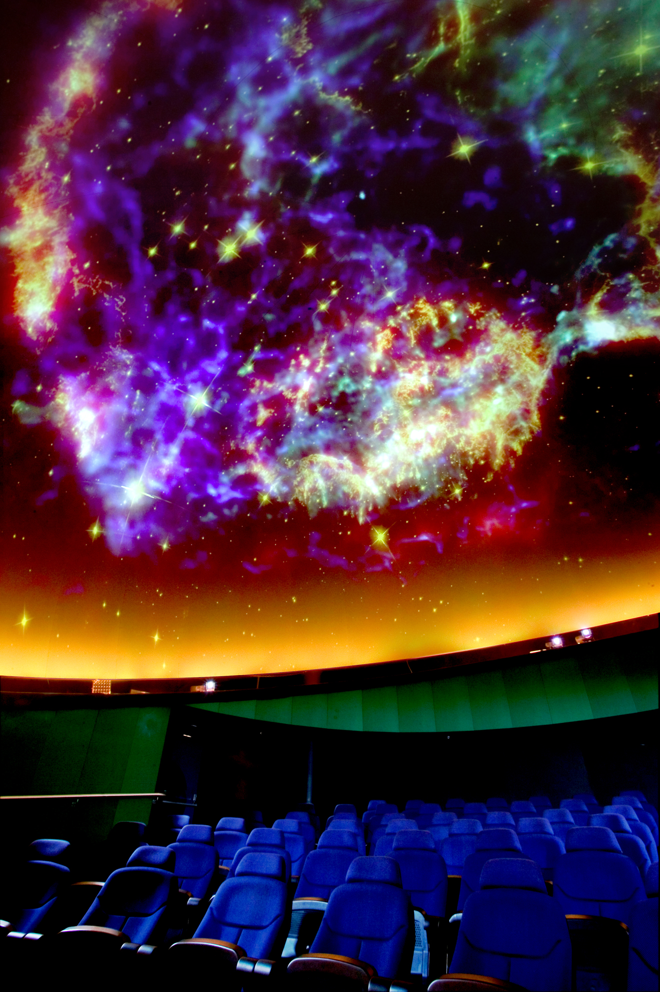 Vibrant cosmic ceiling display at Thinktank Planetarium for immersive events.
