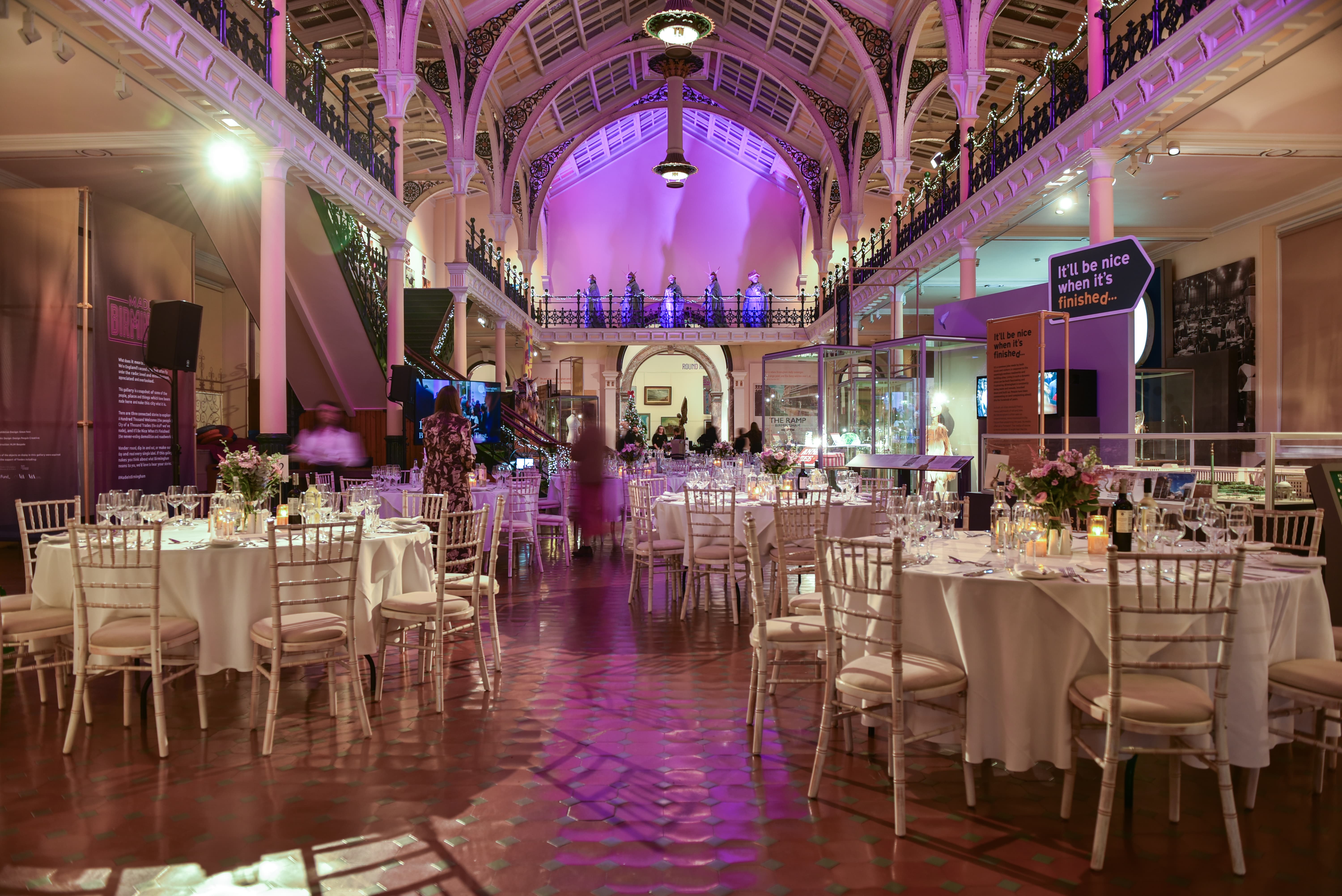 Industrial Gallery Birmingham featuring purple gala lighting and formal banquet seating for events.