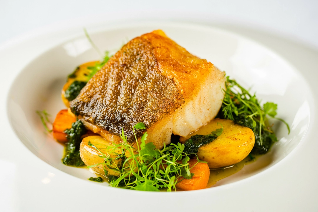 Elegantly plated fish dish at Birmingham Museum, ideal for upscale event catering.