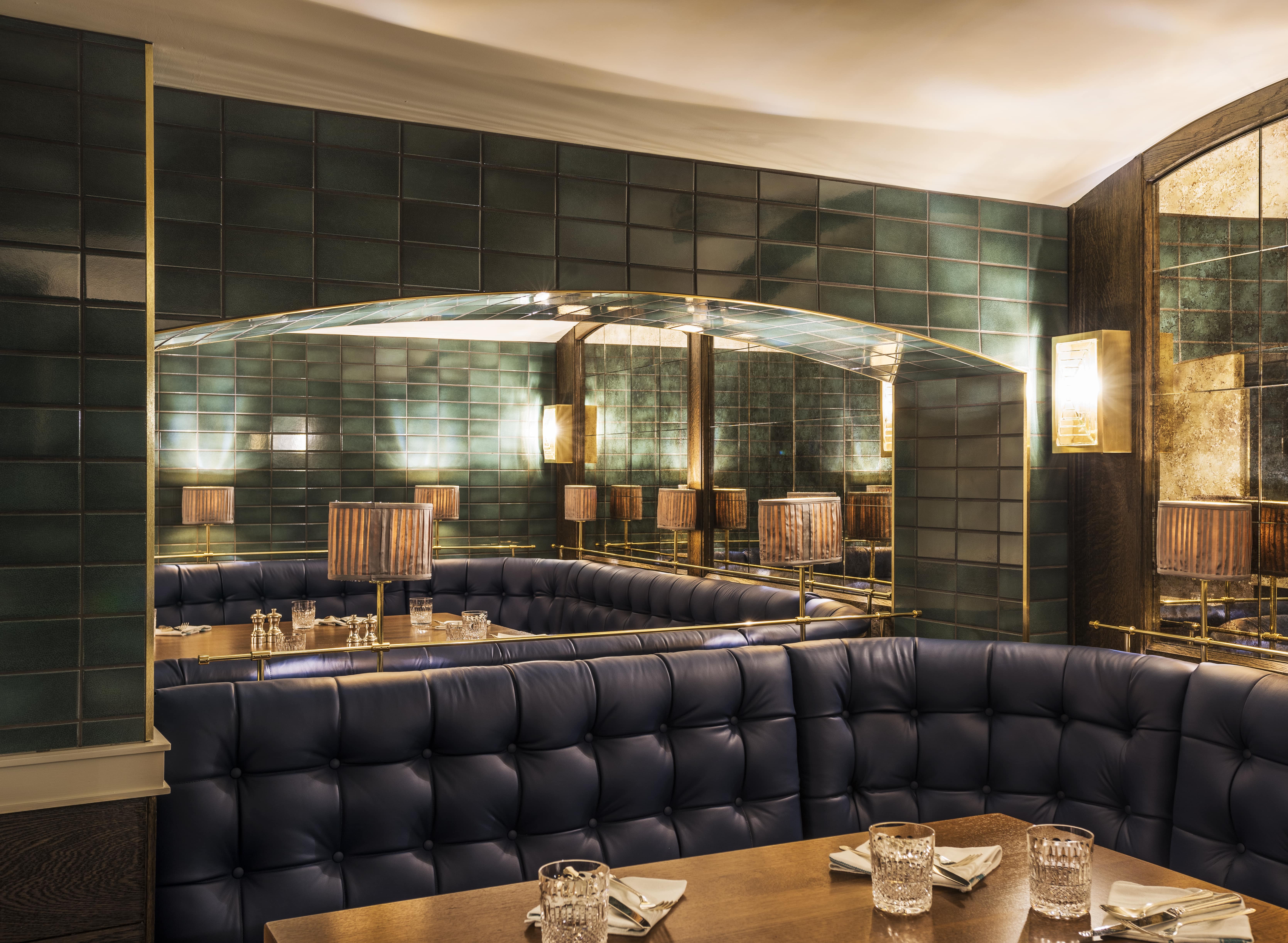 Sloane Place Bar with plush blue seating, ideal for upscale events and intimate gatherings.