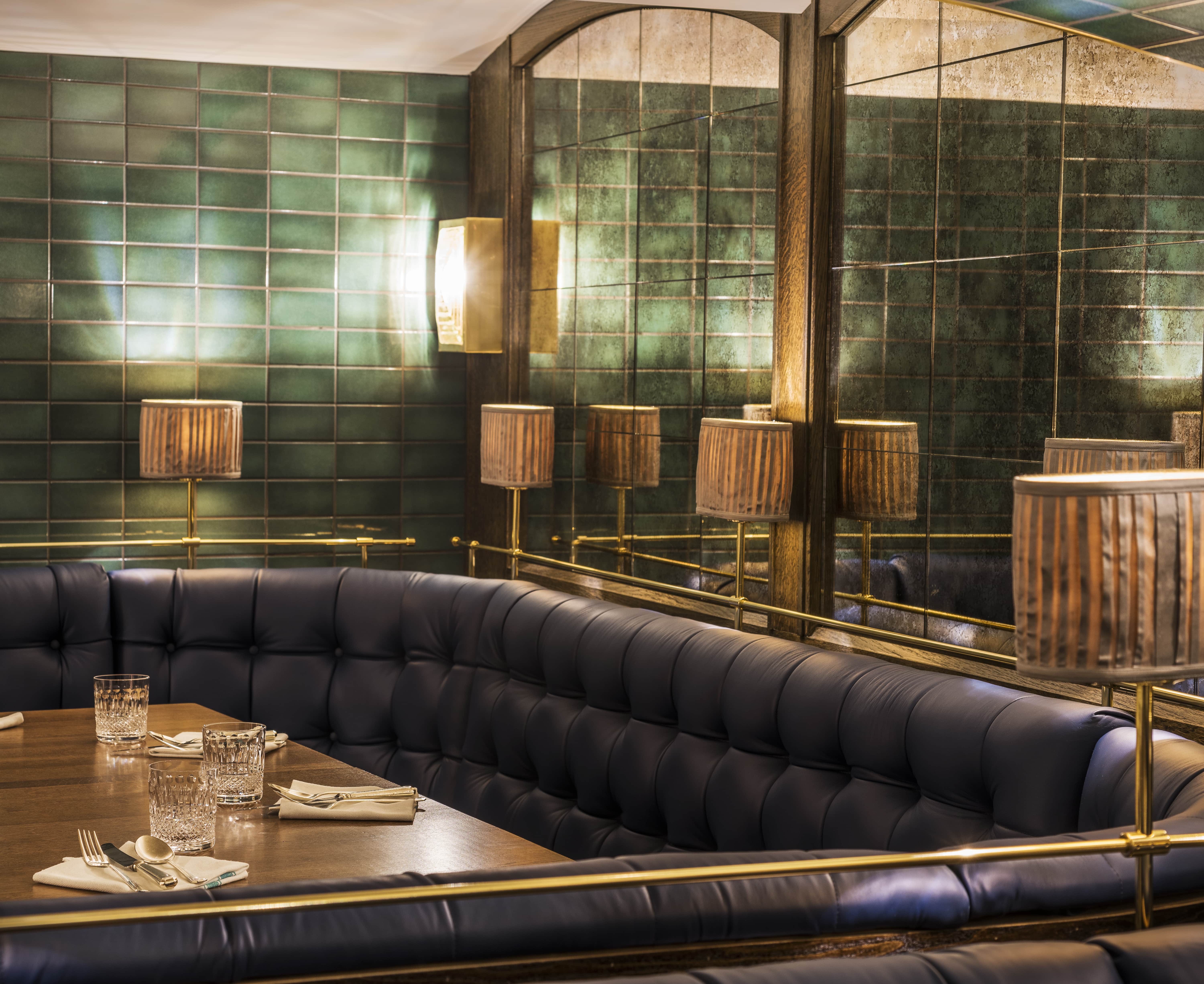 Sloane Place Bar: elegant dining space with plush seating for upscale events and gatherings.