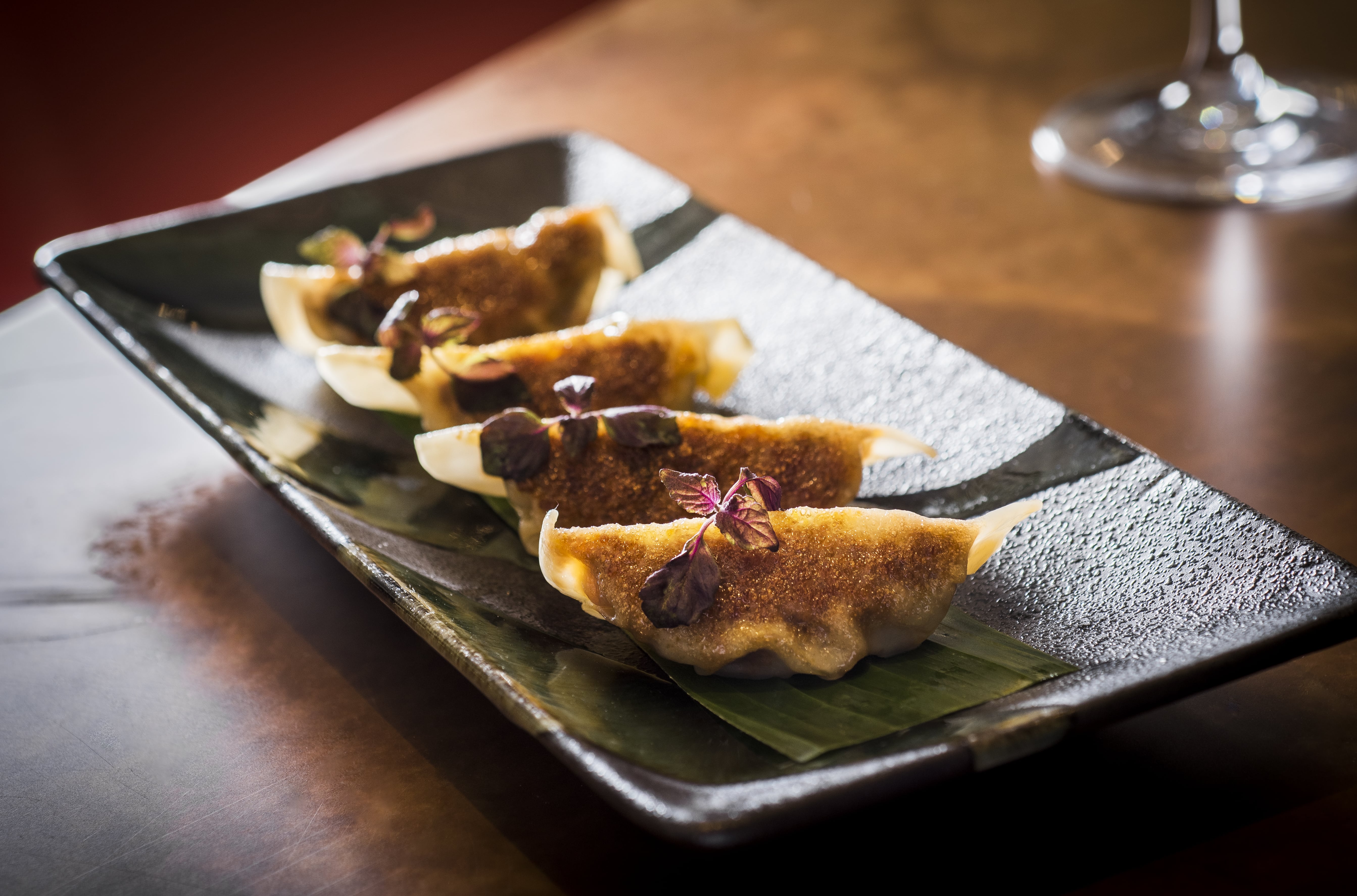 Gourmet dumplings at Sloane Place Bar for upscale catering events and networking.