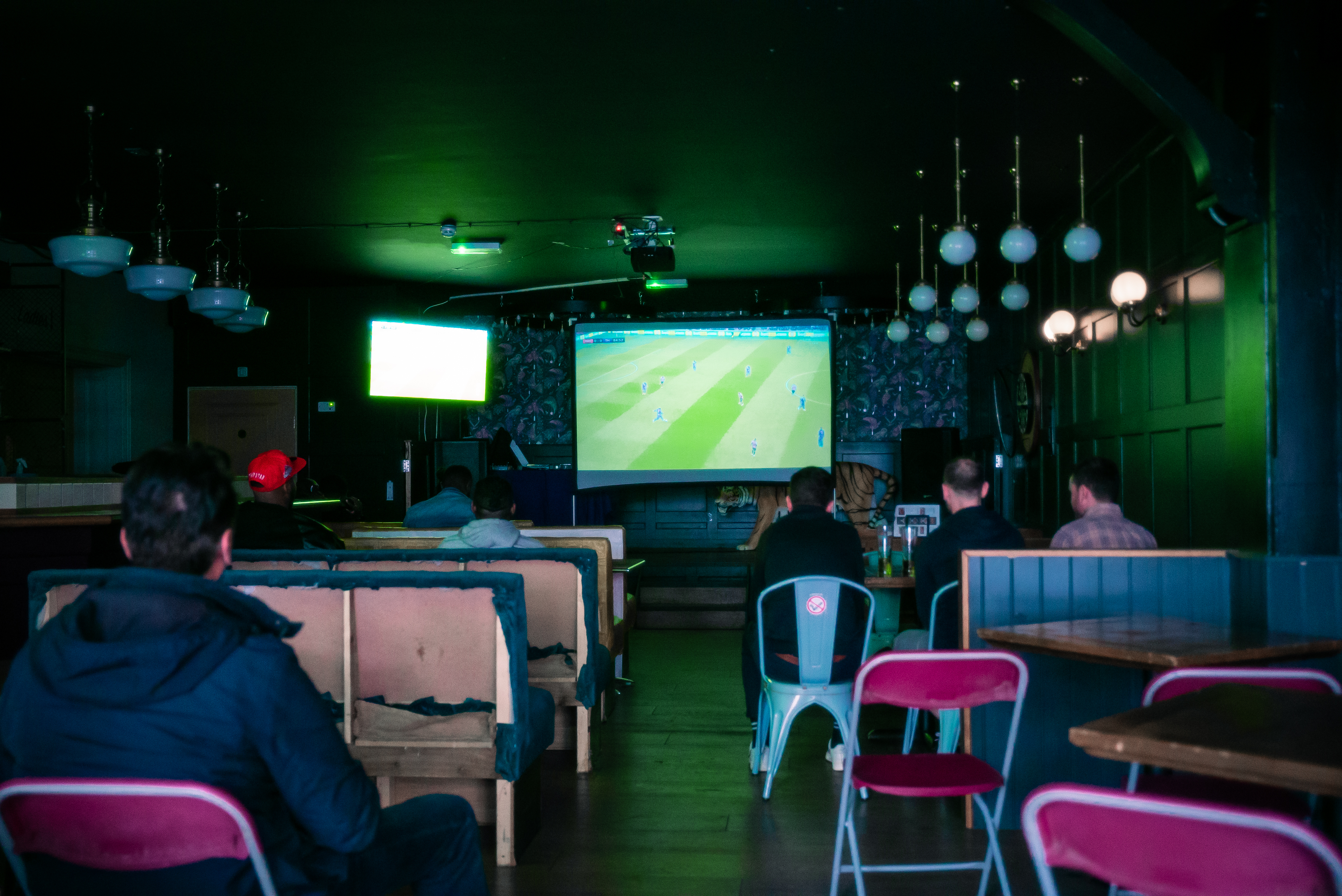 Tigers Lounge sports viewing event with large screen and casual seating.