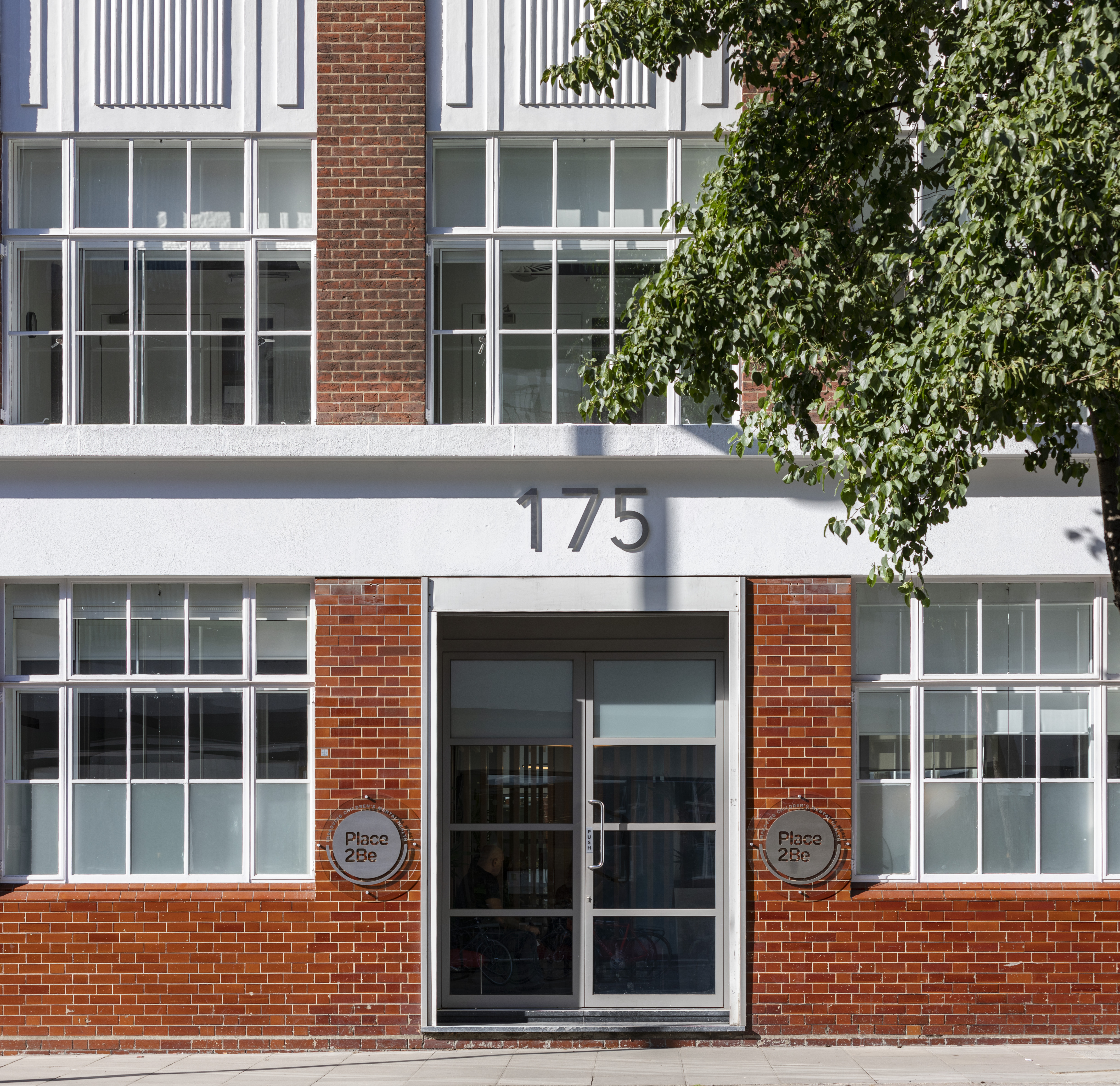 Modern small meeting room with large windows at 175 St John's Street for events.