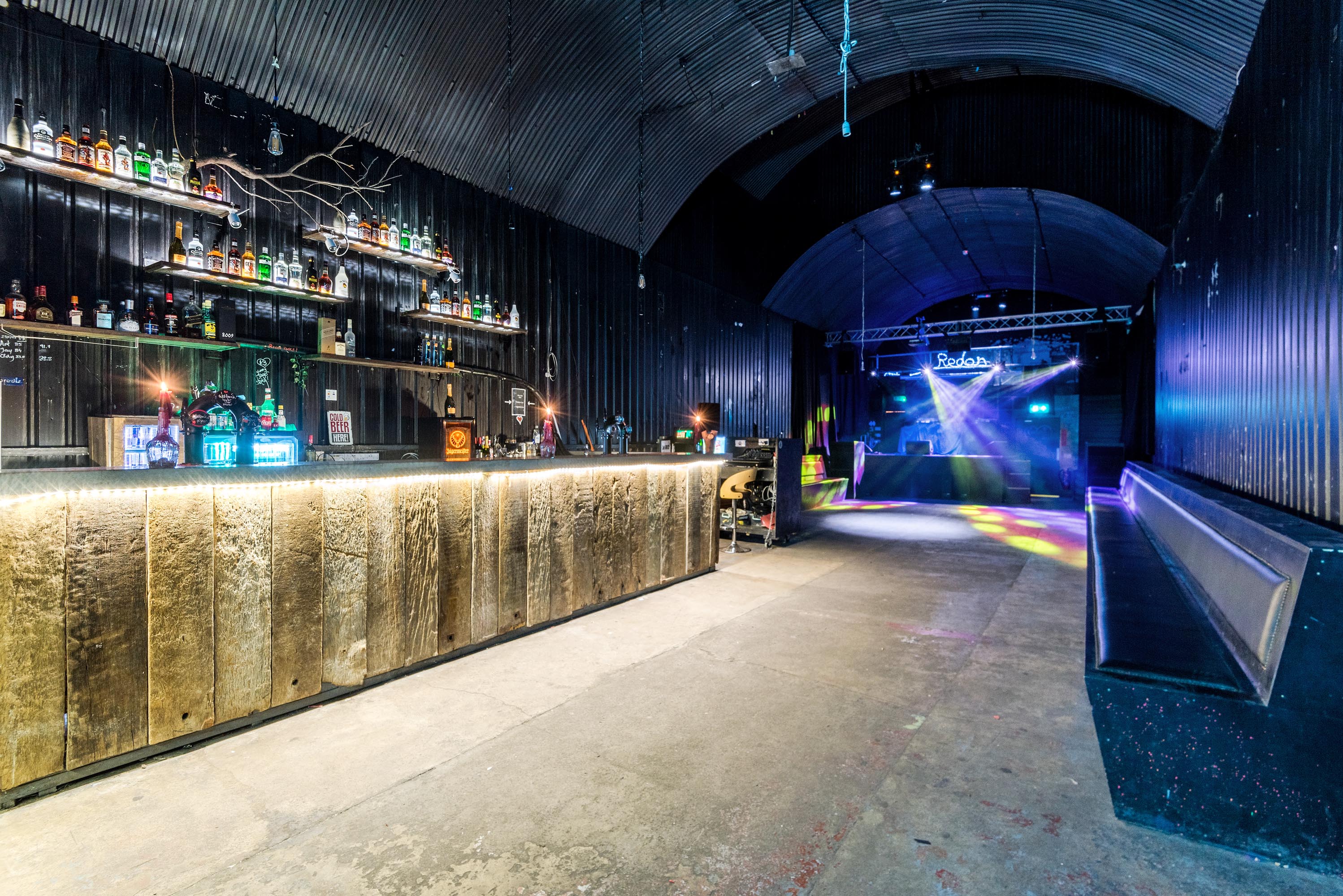 Versatile event space in Space 289 with sleek bar, ideal for corporate and social gatherings.