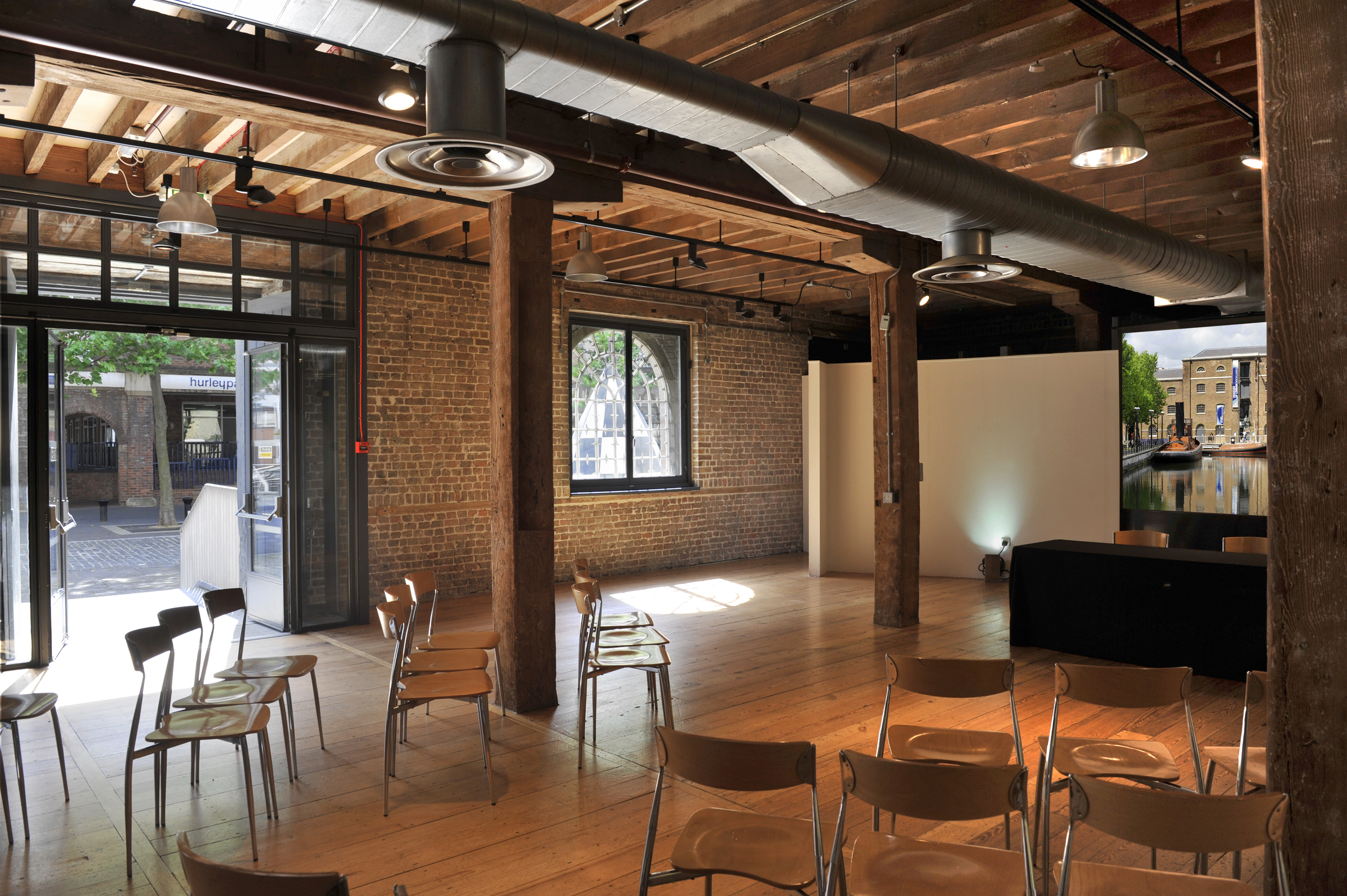 Rum Store event space with exposed brick walls, ideal for workshops and gatherings.