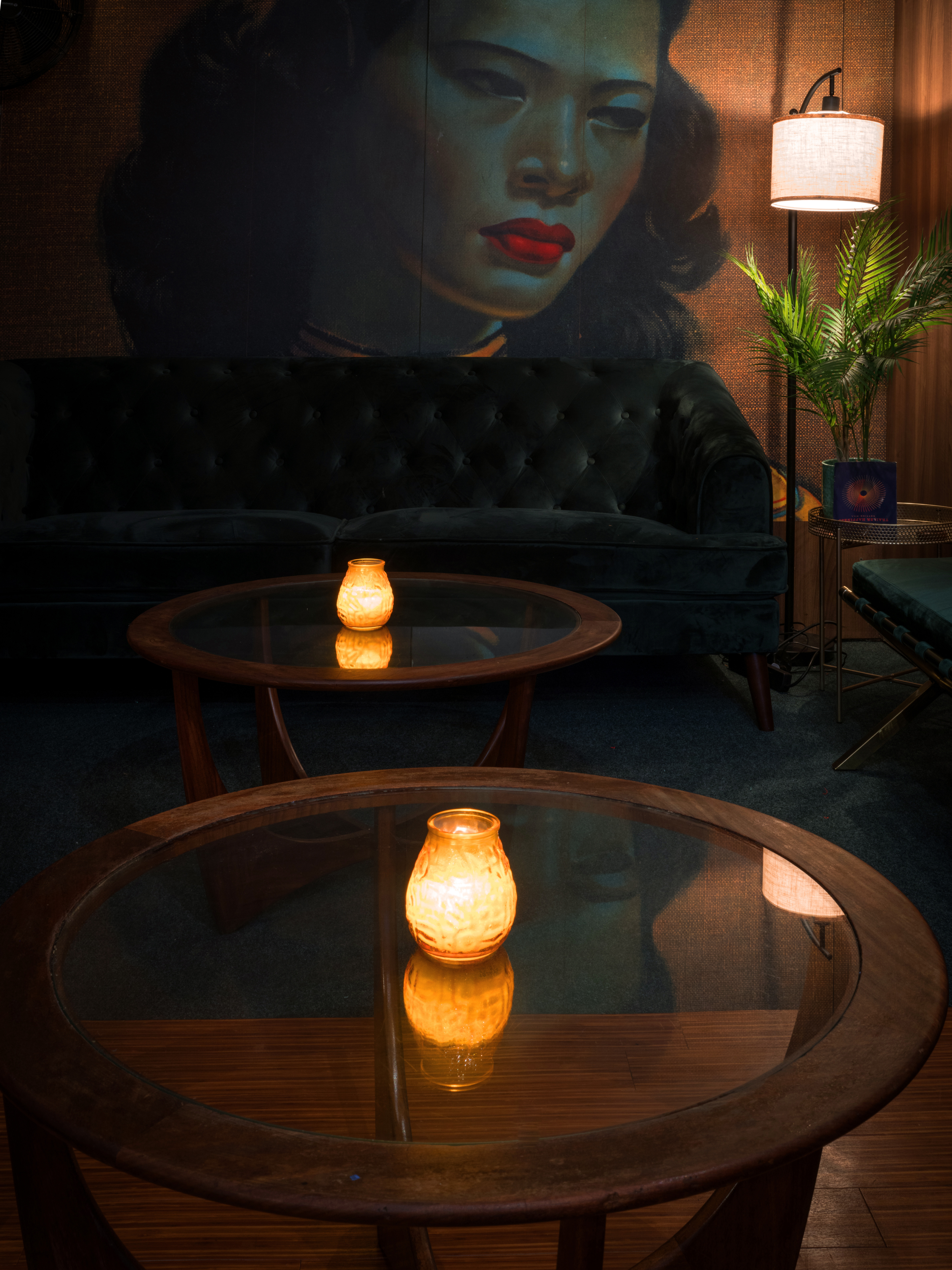 Stylish lounge at The Den, featuring a vintage mural, perfect for networking events.