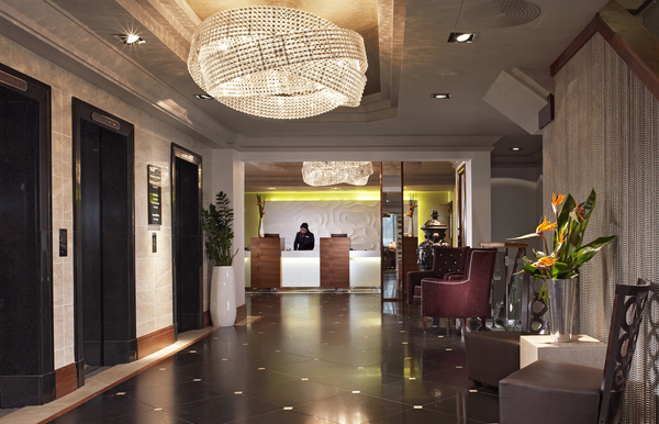 Elegant hotel lobby at Thistle Kensington Gardens, perfect for networking events.