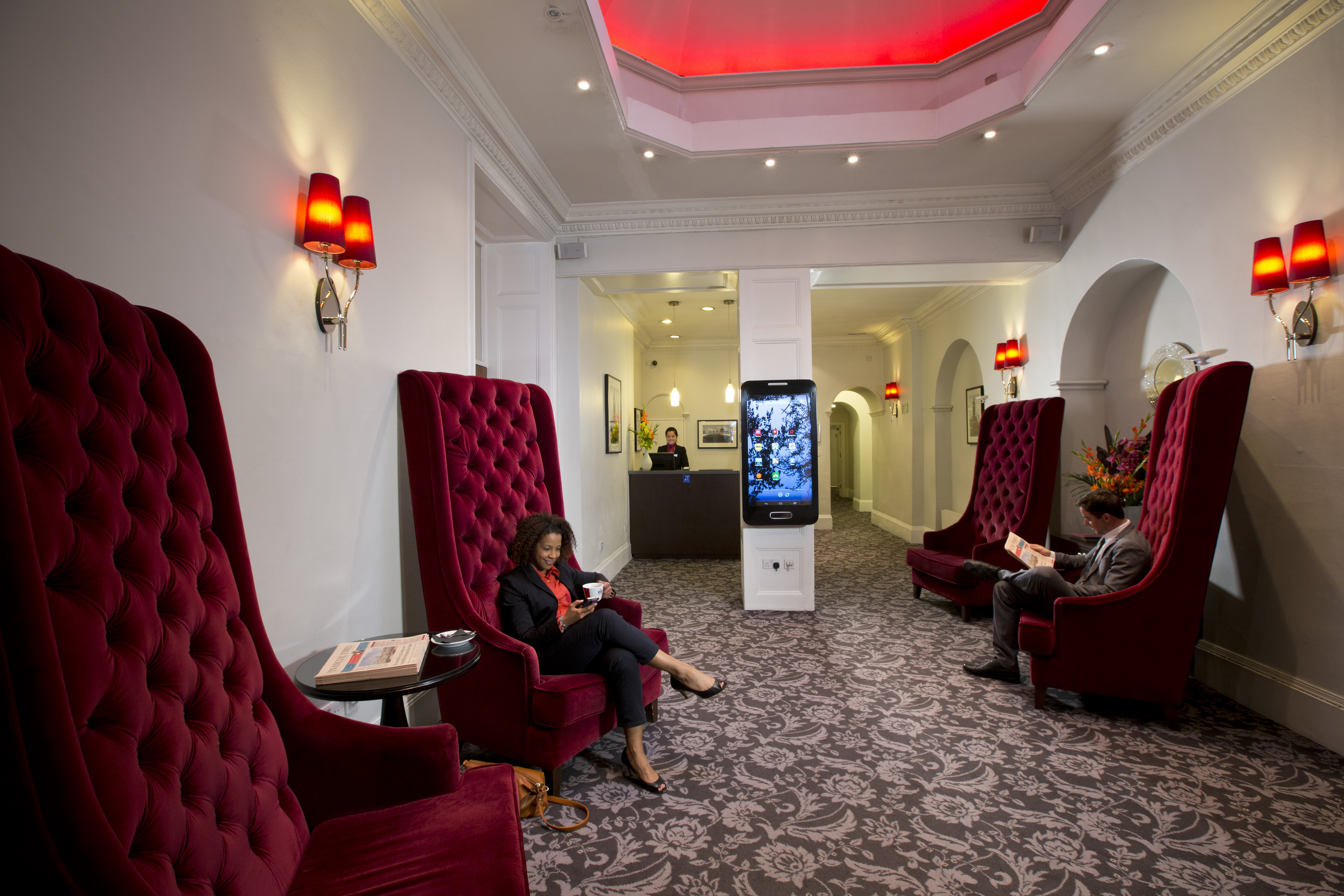 Stylish lobby with plush chairs at Thistle Bloomsbury Park, ideal for networking events.