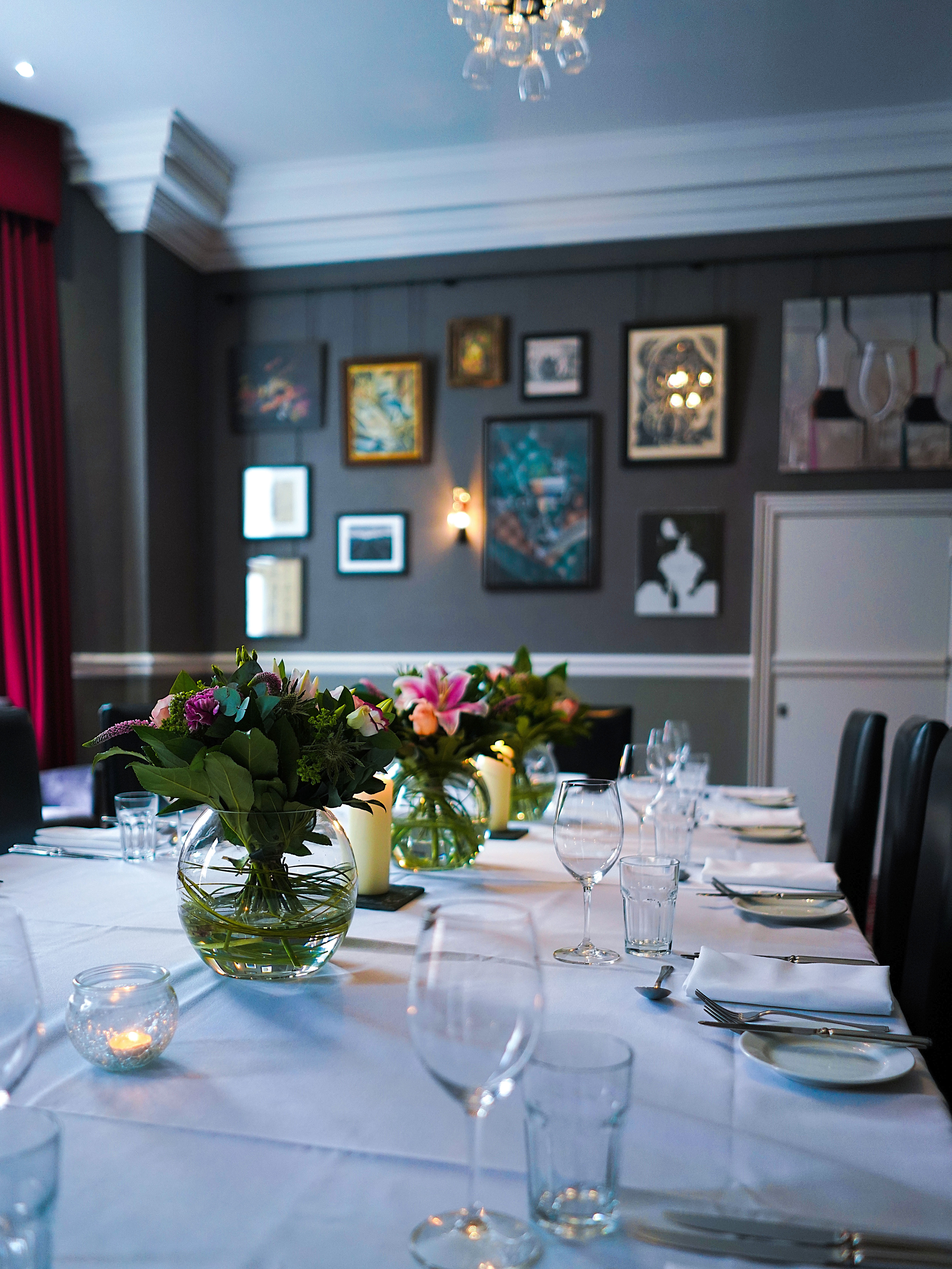 Elegant dining table with floral centerpieces at Hotel du Vin Birmingham event.